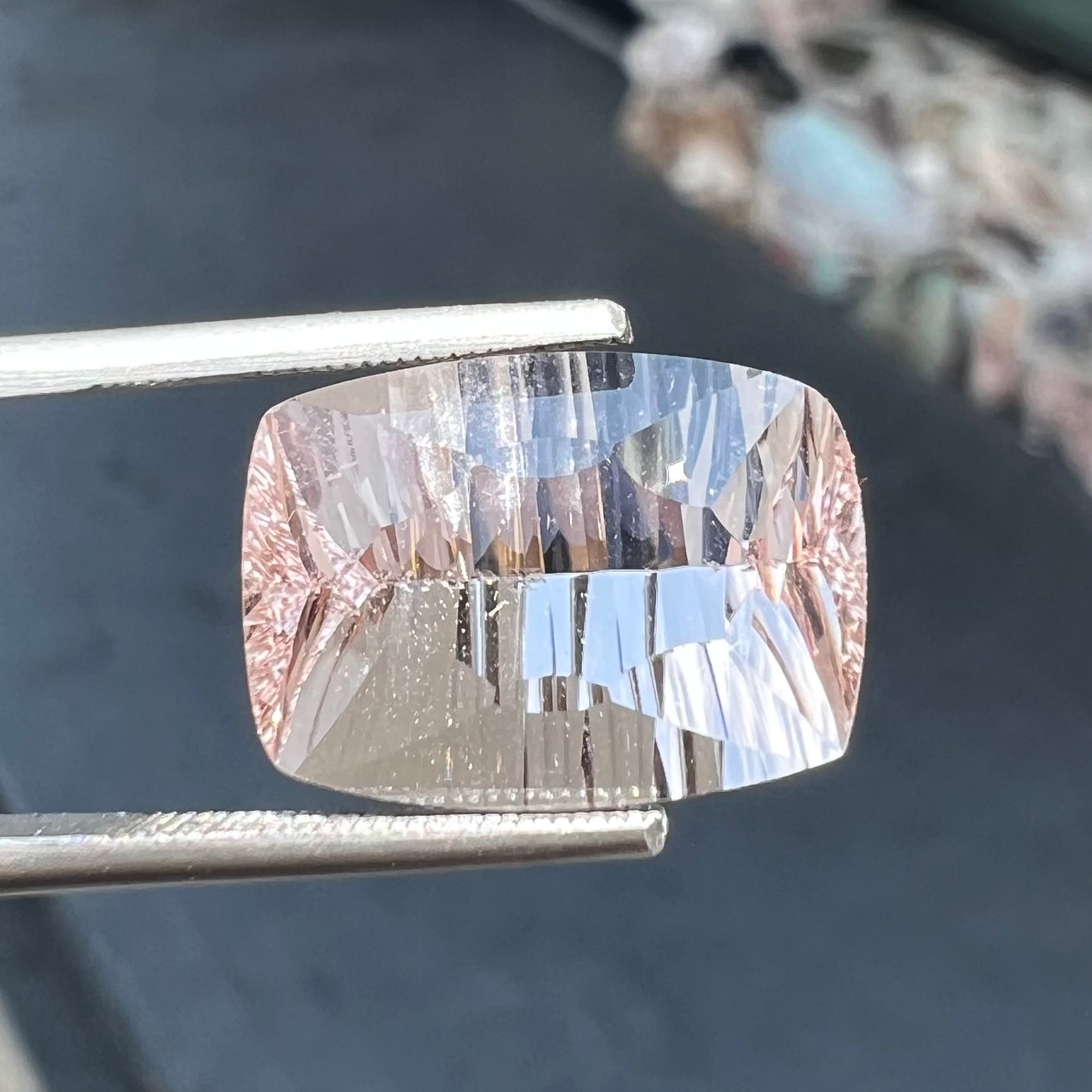 A loose, modified cushion cut pink morganite stone.