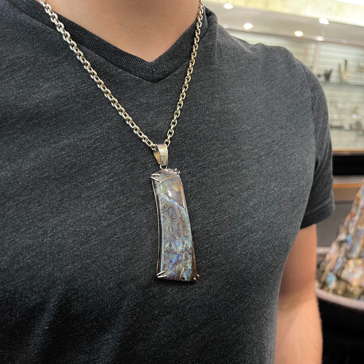 A men's sterling silver pendant set with a natural boulder opal from Quilpie, Australia.