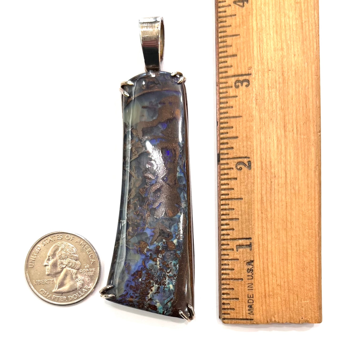 A men's sterling silver pendant set with a natural boulder opal from Quilpie, Australia.