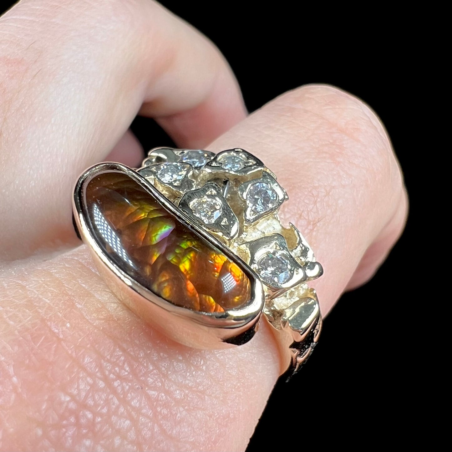 A ladies' nugget style yellow gold Mexican fire agate and diamond ring.