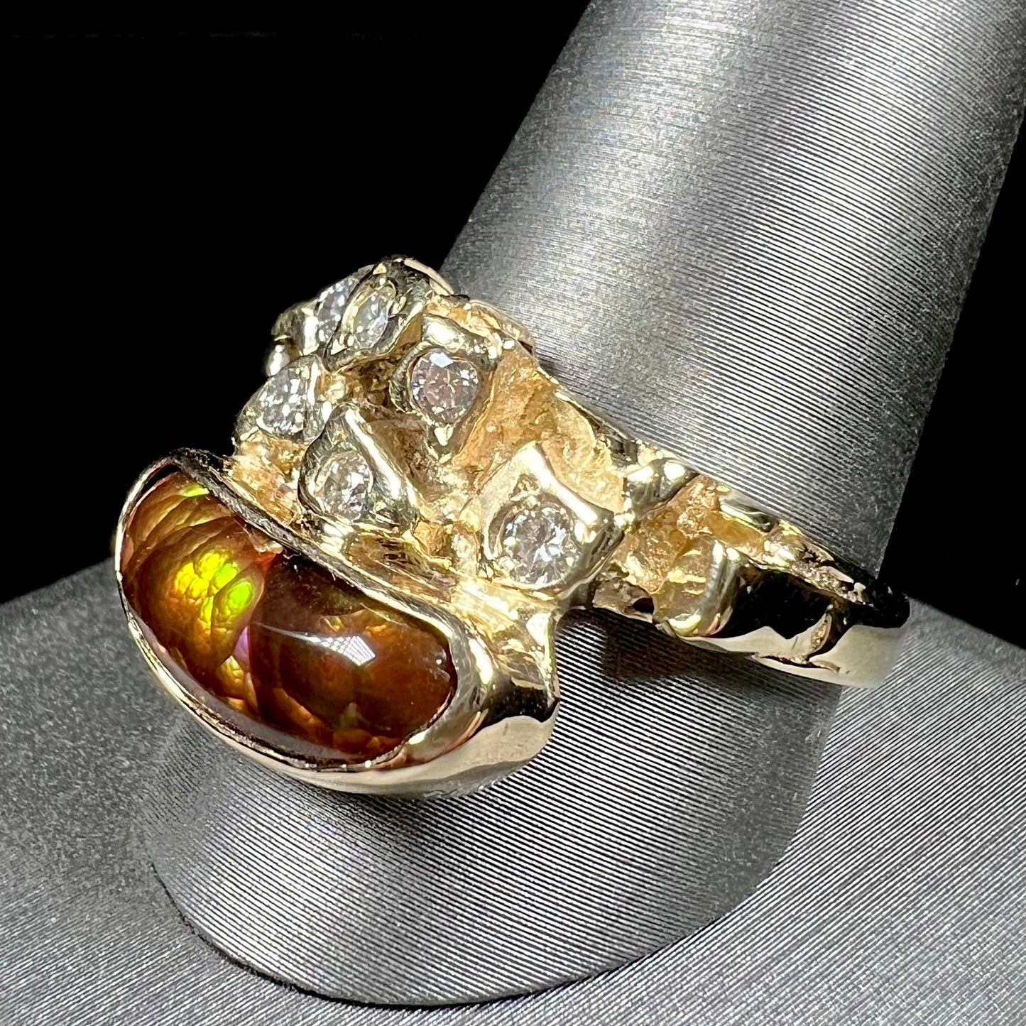 A ladies' nugget style yellow gold Mexican fire agate and diamond ring.