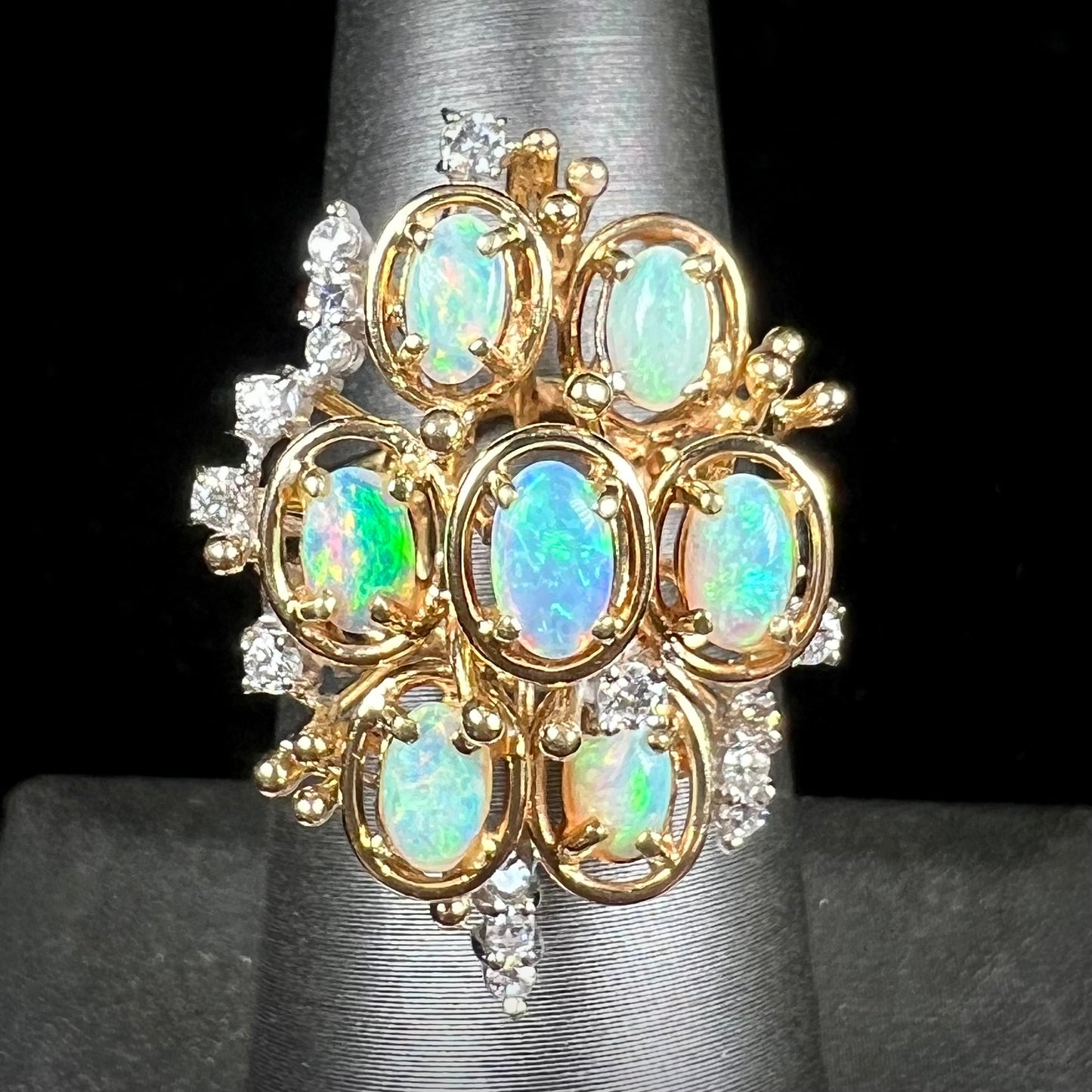 A ladies' vintage mid-century modern style opal and diamond cluster ring in yellow gold.