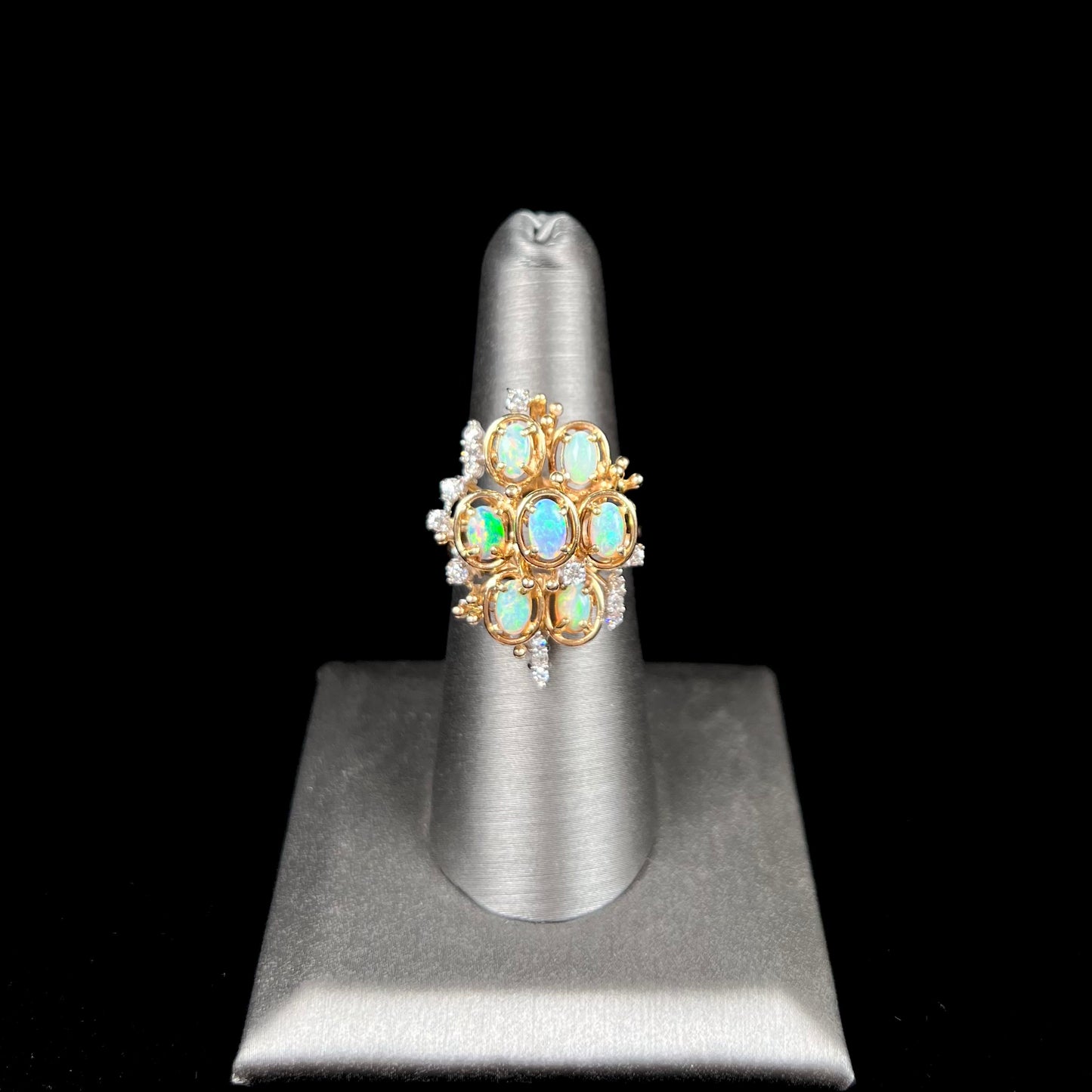 A ladies' vintage mid-century modern style opal and diamond cluster ring in yellow gold.
