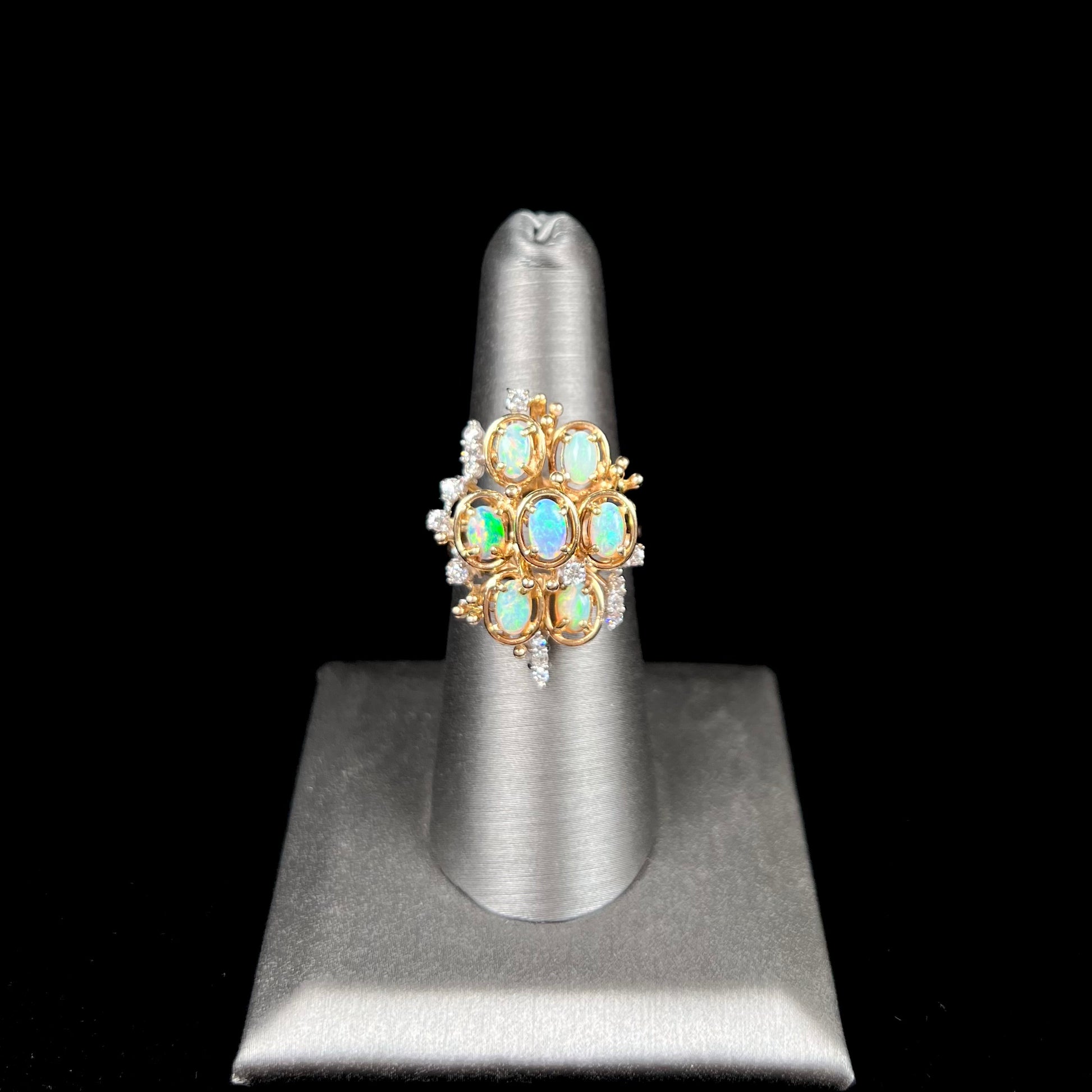 A ladies' vintage mid-century modern style opal and diamond cluster ring in yellow gold.