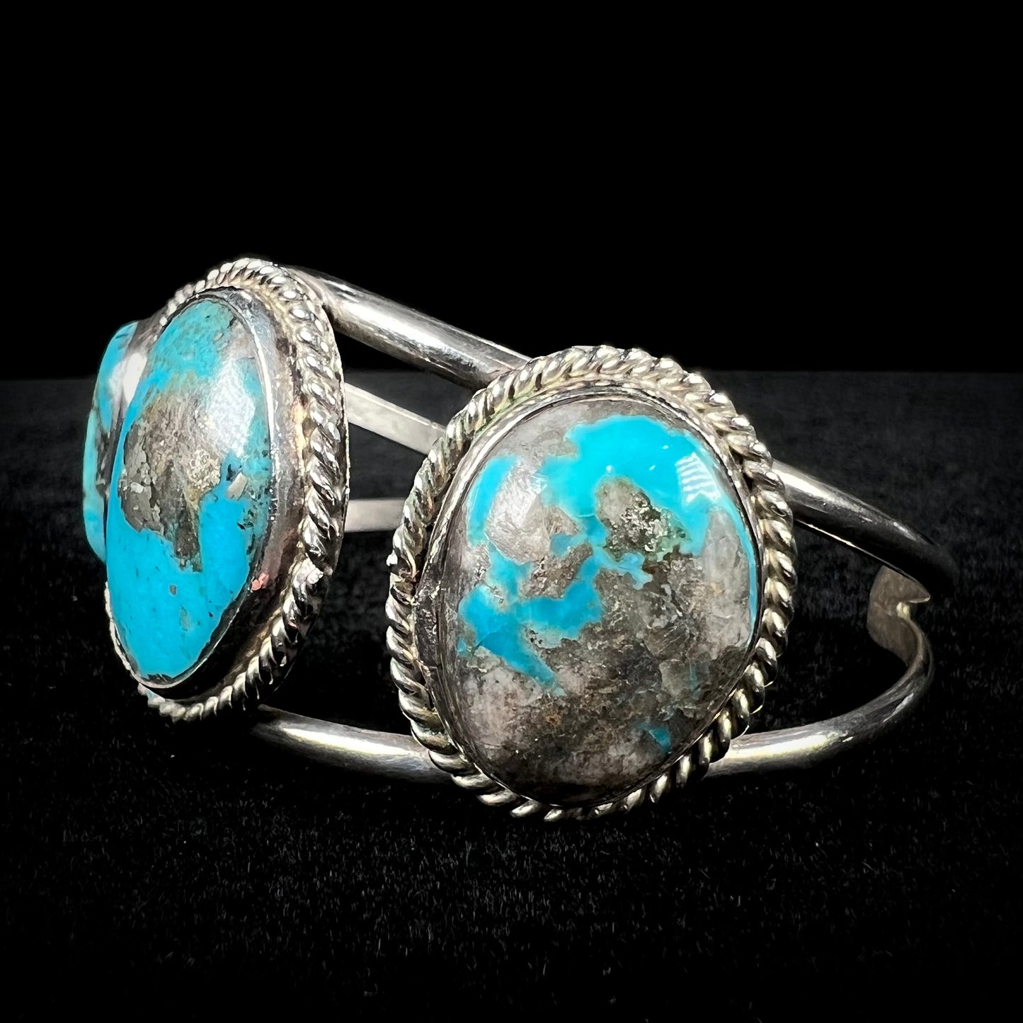 A ladies' three stone silver cuff bracelet accented with rope bezels and set with Morenci turquoise.