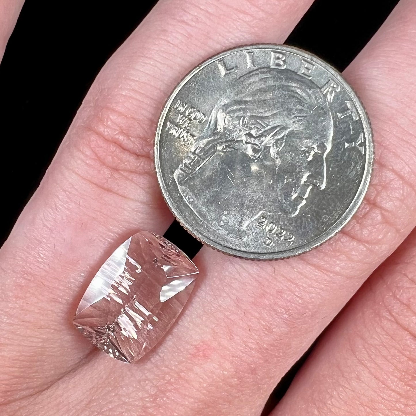 A loose, modified cushion cut pink morganite stone.