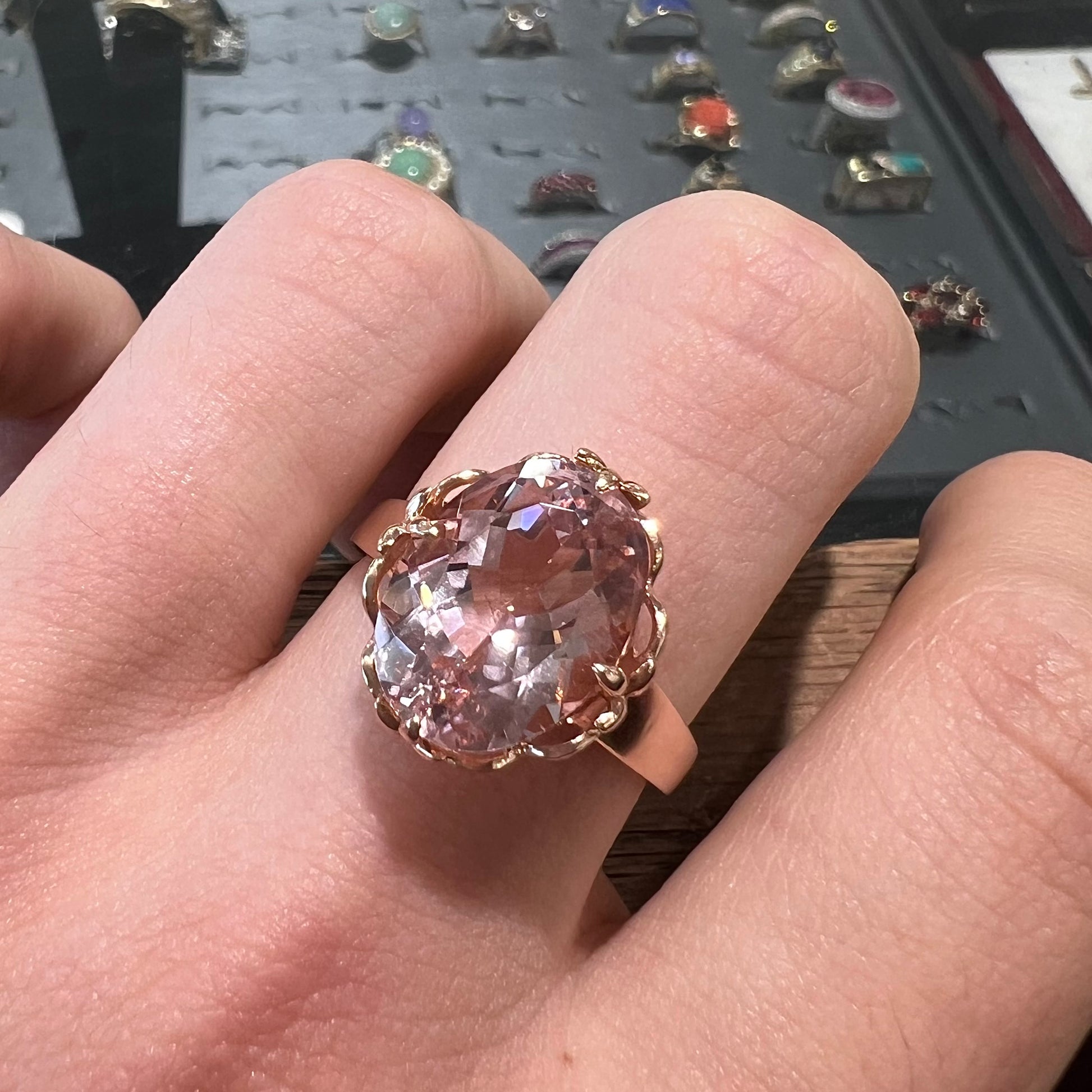 A ladies' rose gold solitaire ring set with an oval cut pink morganite gemstone.