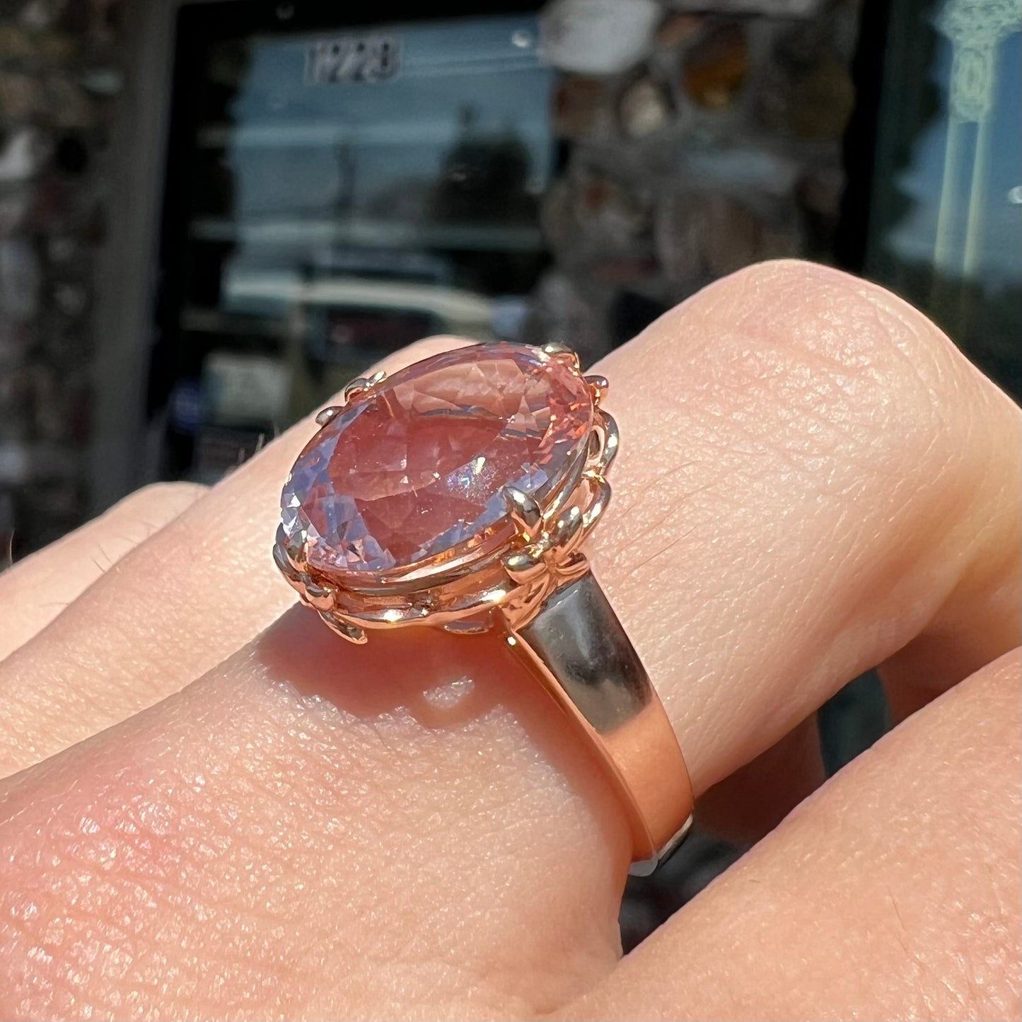 A ladies' rose gold solitaire ring set with an oval cut pink morganite gemstone.