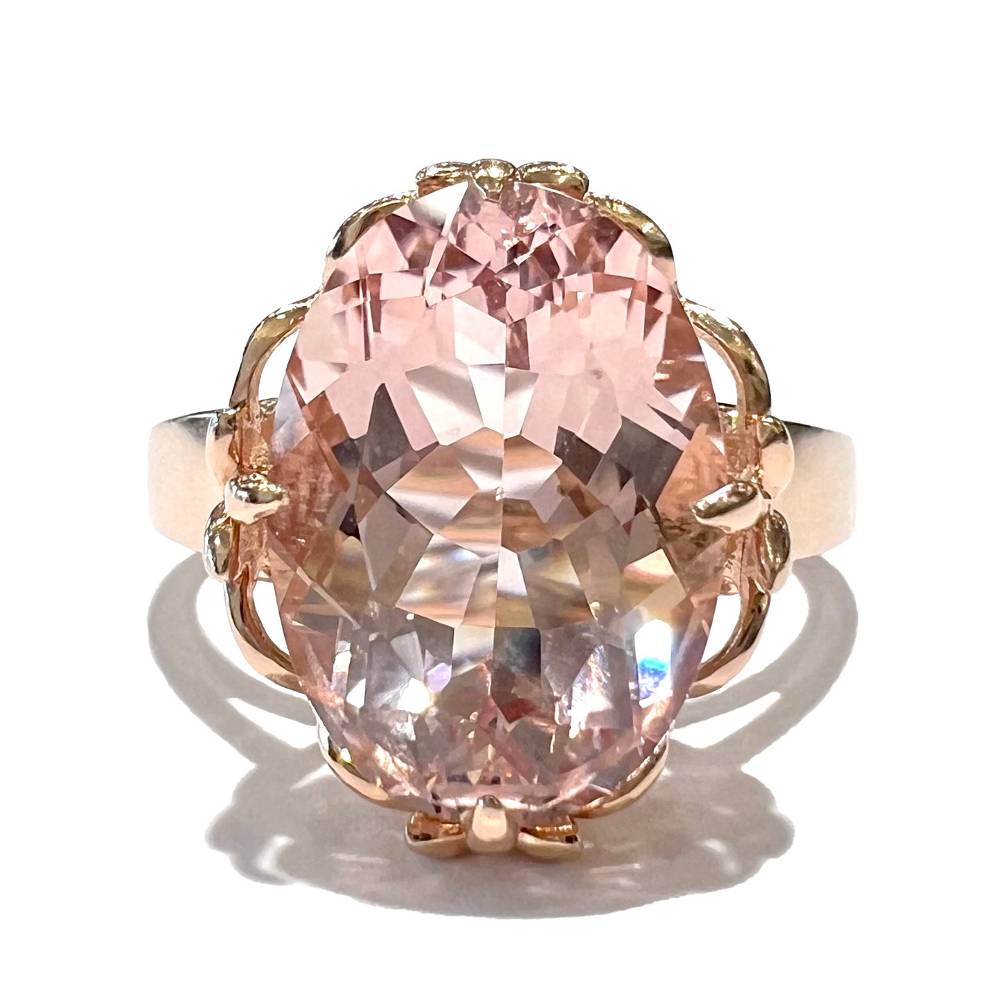 A ladies' rose gold solitaire ring set with an oval cut pink morganite gemstone.