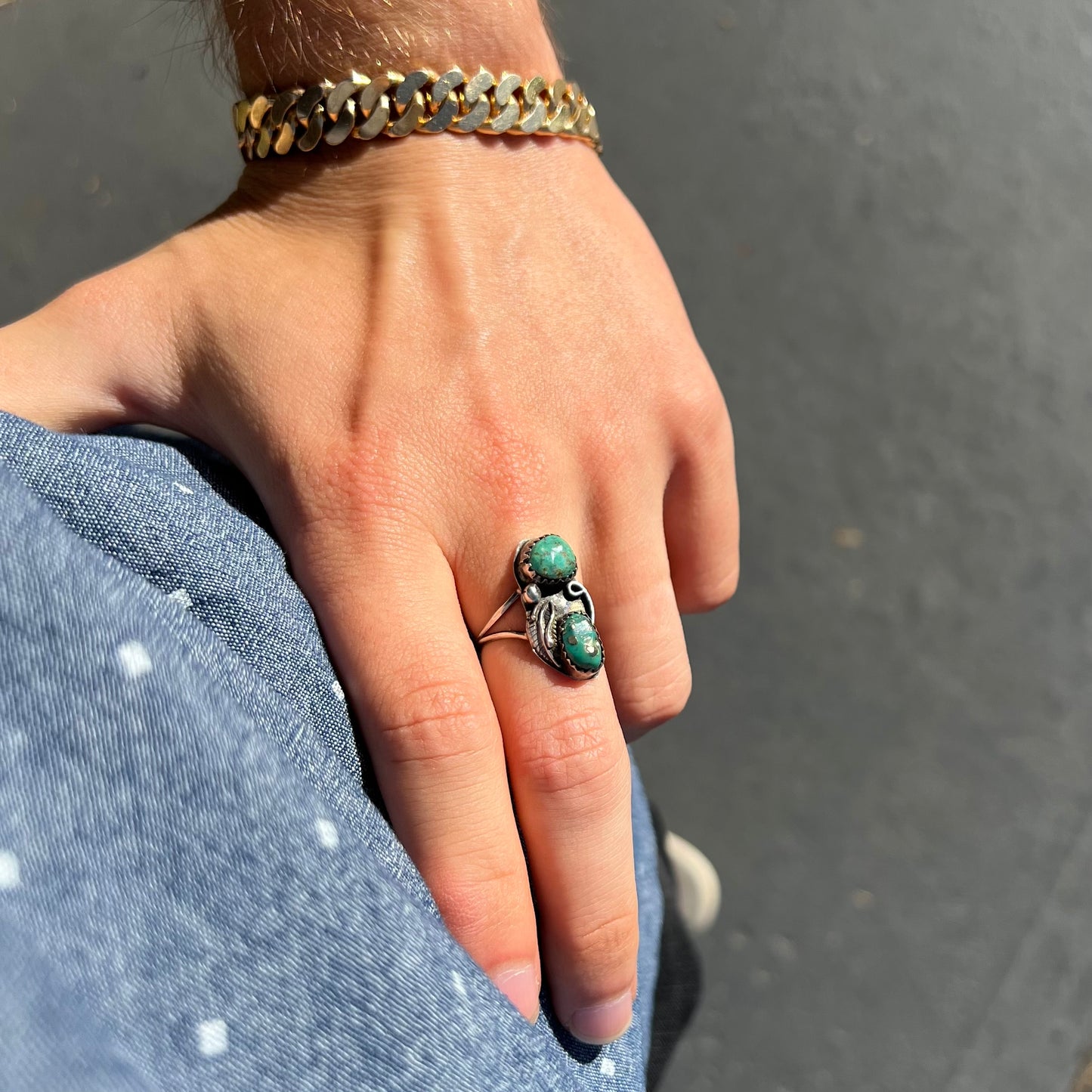 A ladies' sterling silver and green Morenci turquoise ring. The ring is handmade in the Navajo style.