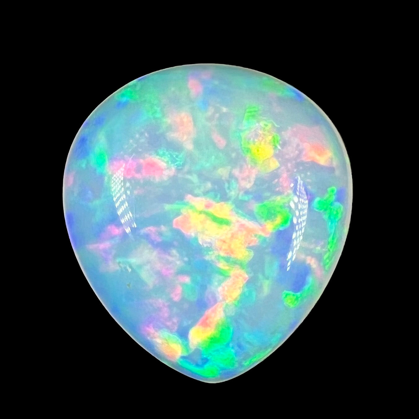 A loose, pear shaped Ethiopian fire opal with multicolor fire.