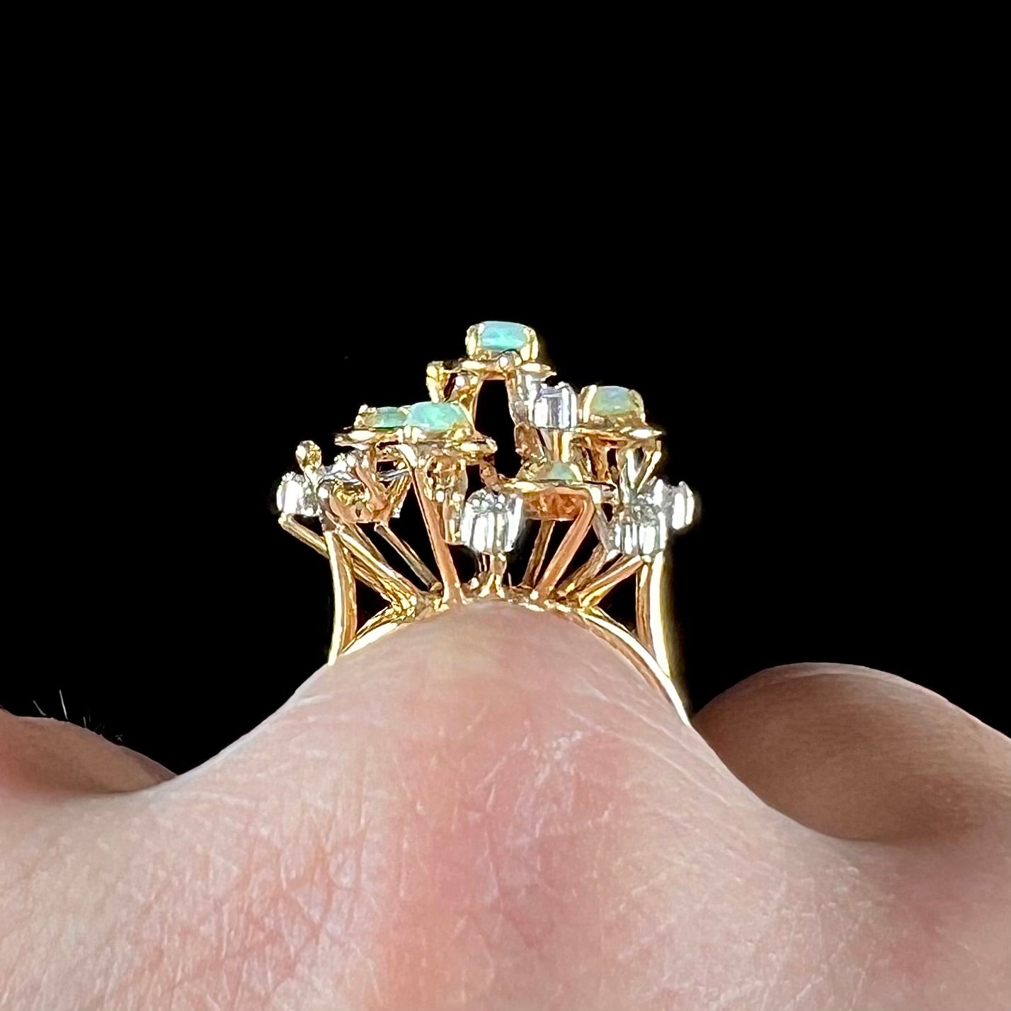 A ladies' vintage mid-century modern style opal and diamond cluster ring in yellow gold.