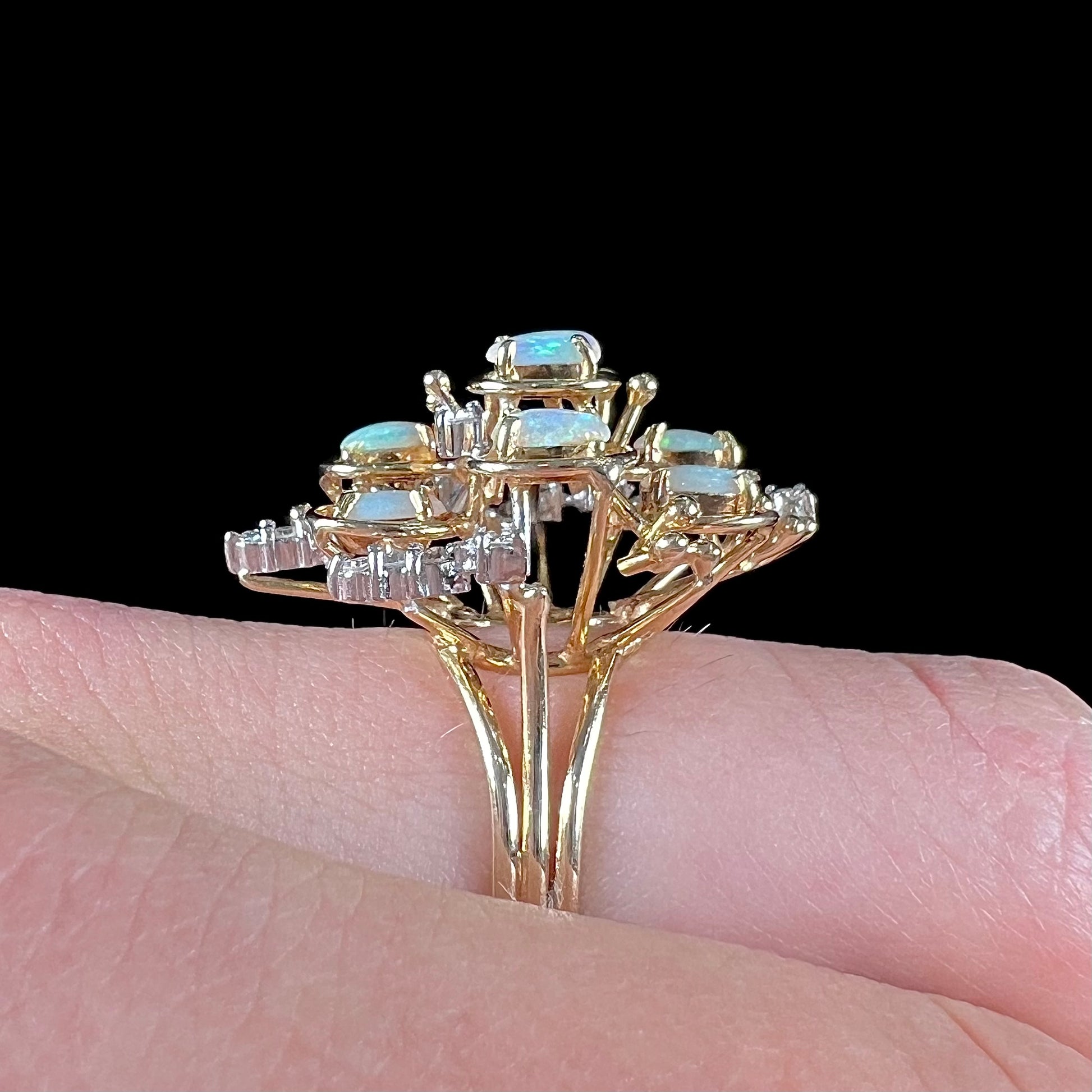 A ladies' vintage mid-century modern style opal and diamond cluster ring in yellow gold.