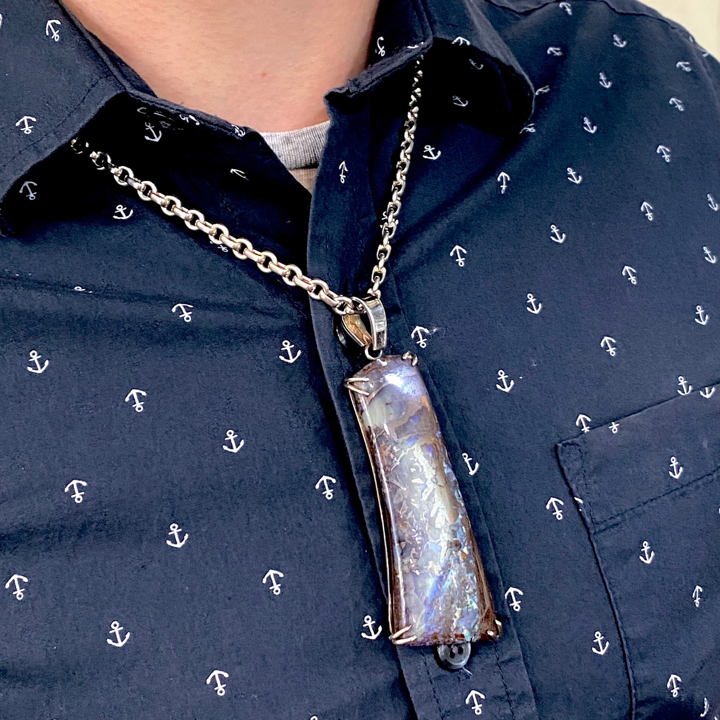 A men's sterling silver pendant set with a natural boulder opal from Quilpie, Australia.