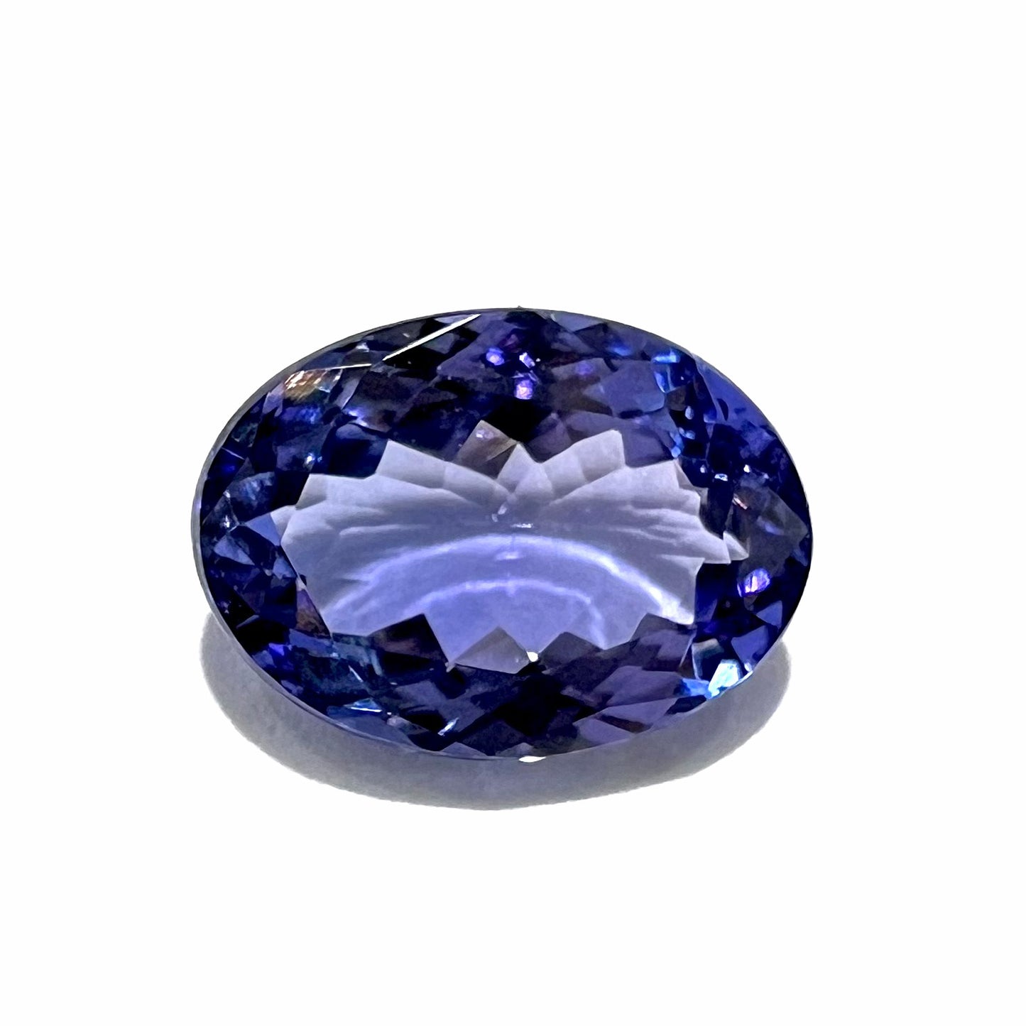 A loose, oval cut tanzanite gemstone.