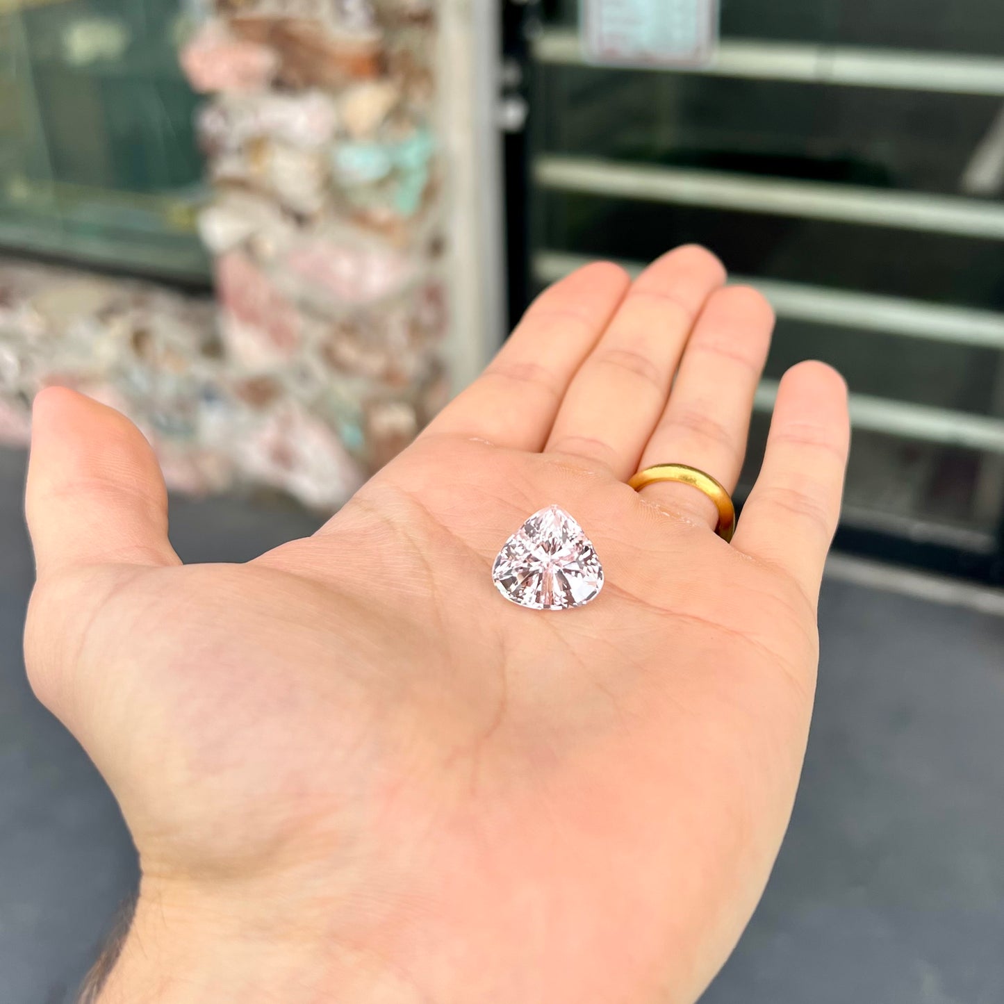 A loose, modified pear shaped kunzite gemstone.