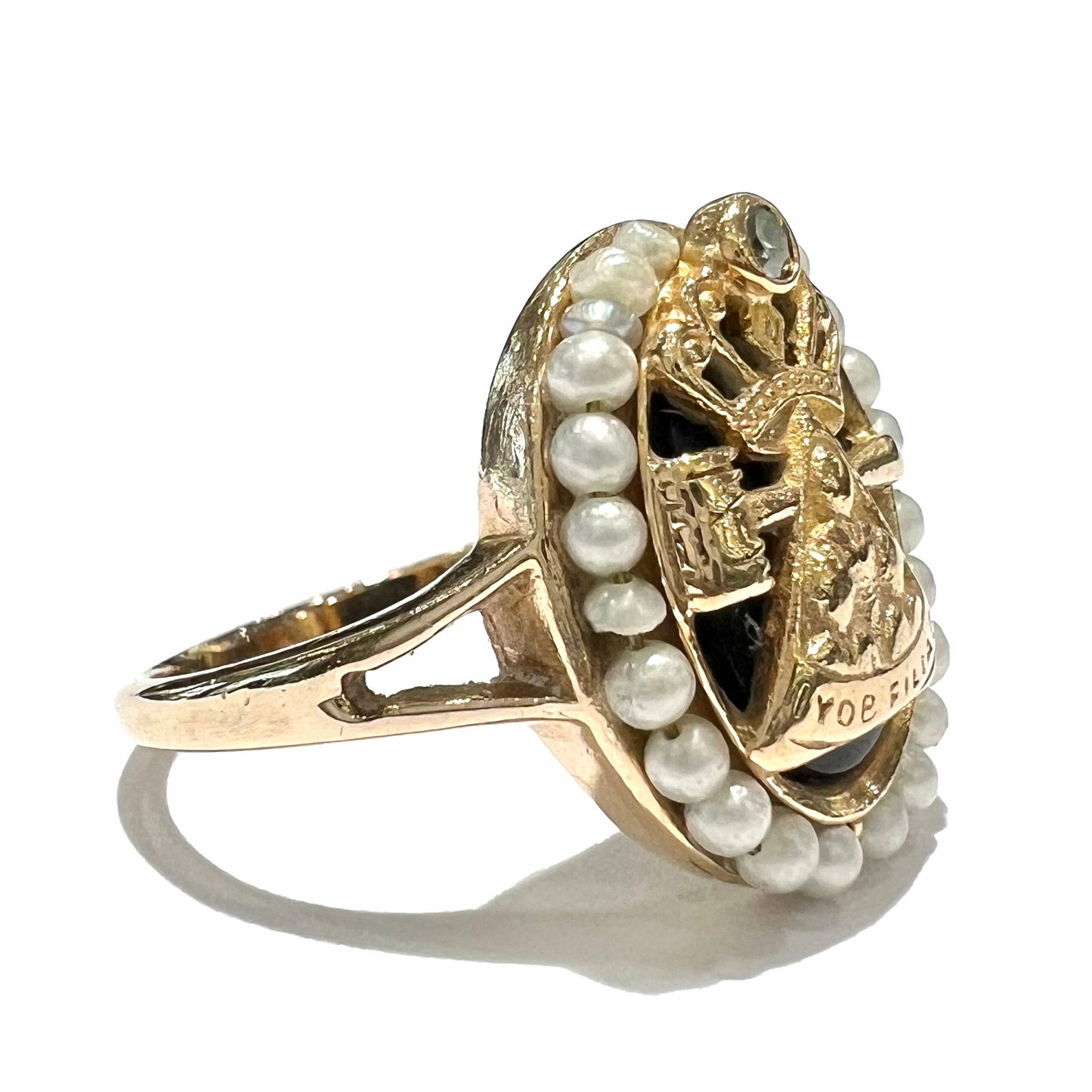 A ladies' Job's Daughters youth organization ring cast in 14 karat gold, set with a diamond and string of pearls.