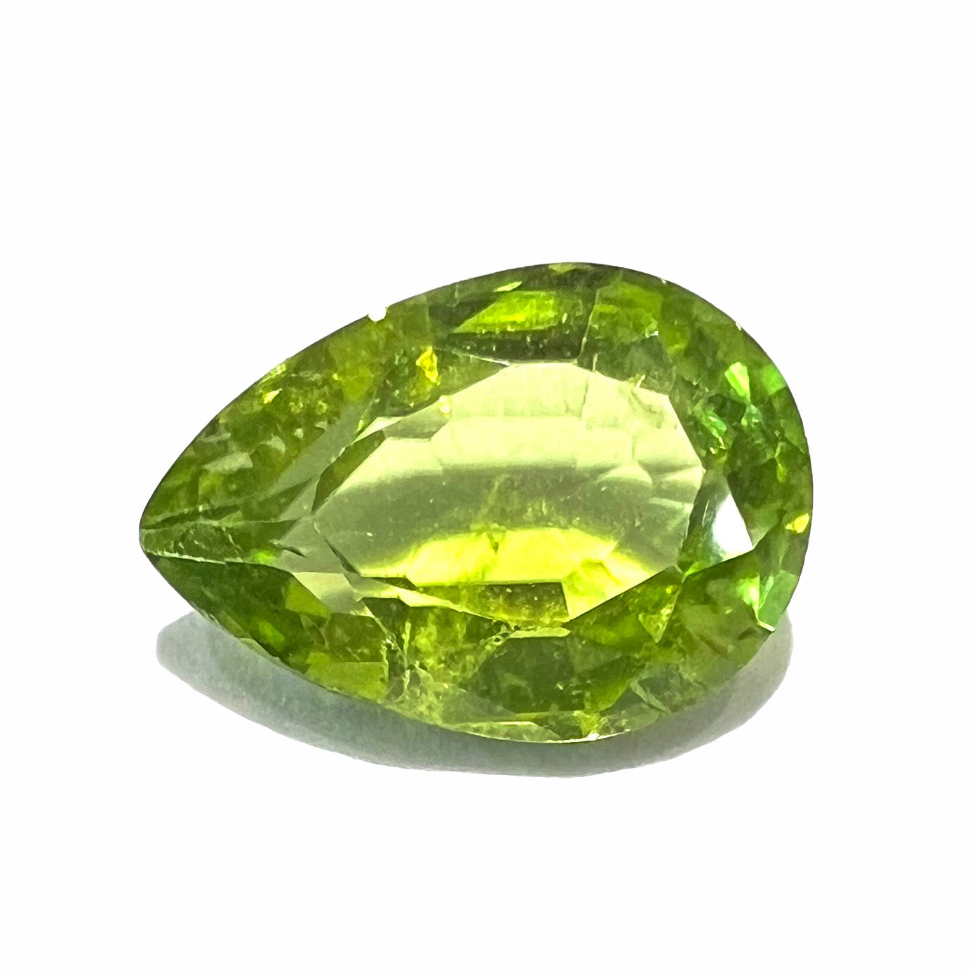A loose, yellow green, pear shaped peridot gemstone.  The stone weighs 2.29 carats.