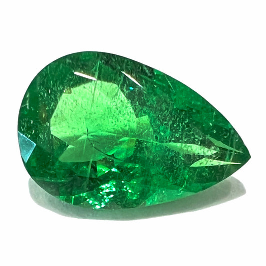 A loose, pear shaped tsavorite garnet gemstone.  The stone is vivid green color and weighs 2.35 carats.
