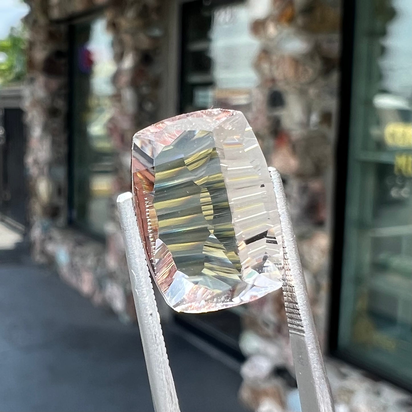 A loose, modified cushion cut pink morganite stone.