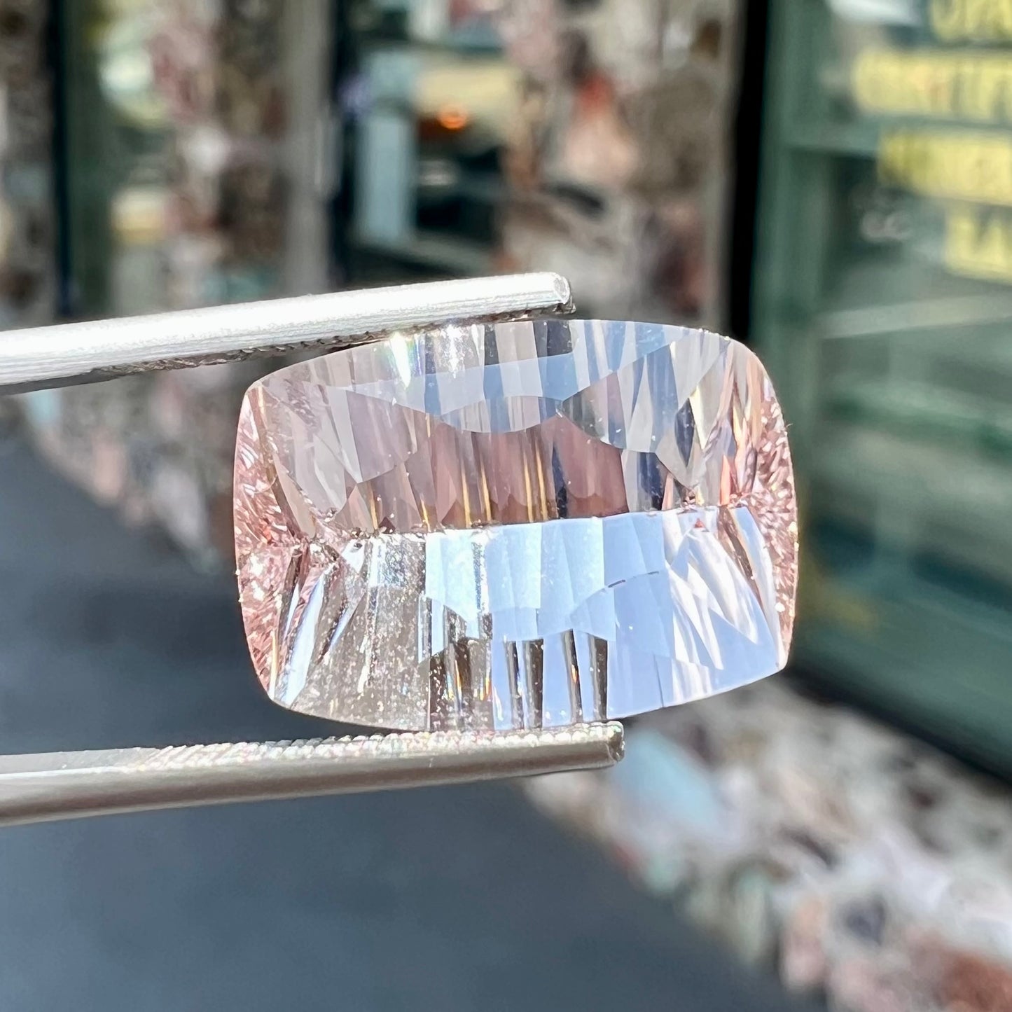 A loose, modified cushion cut pink morganite stone.