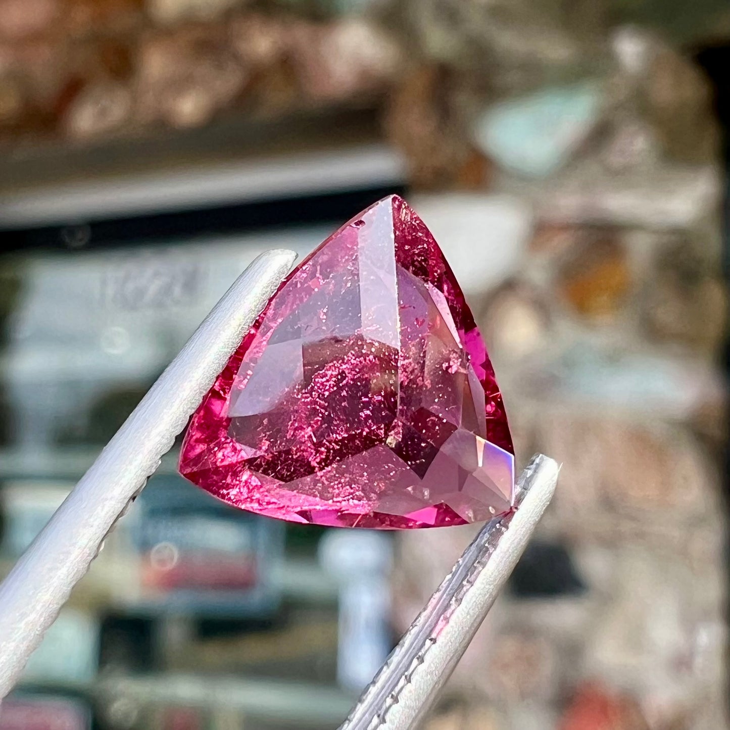A trillion cut pink tourmaline gemstone.