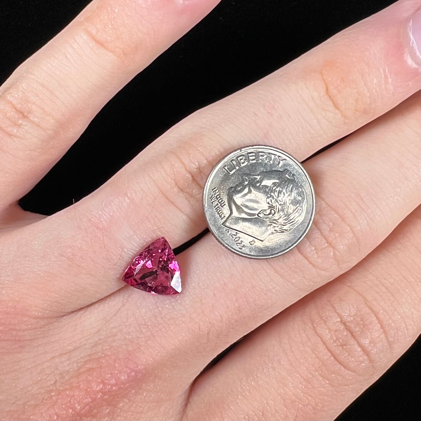 A trillion cut pink tourmaline gemstone.