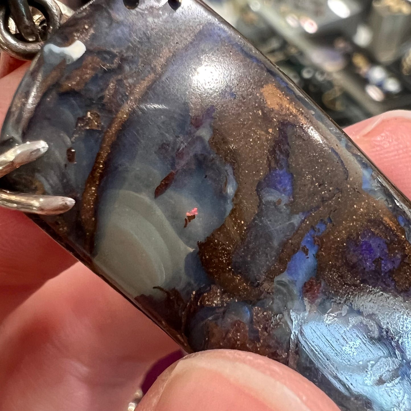 A men's sterling silver pendant set with a natural boulder opal from Quilpie, Australia.