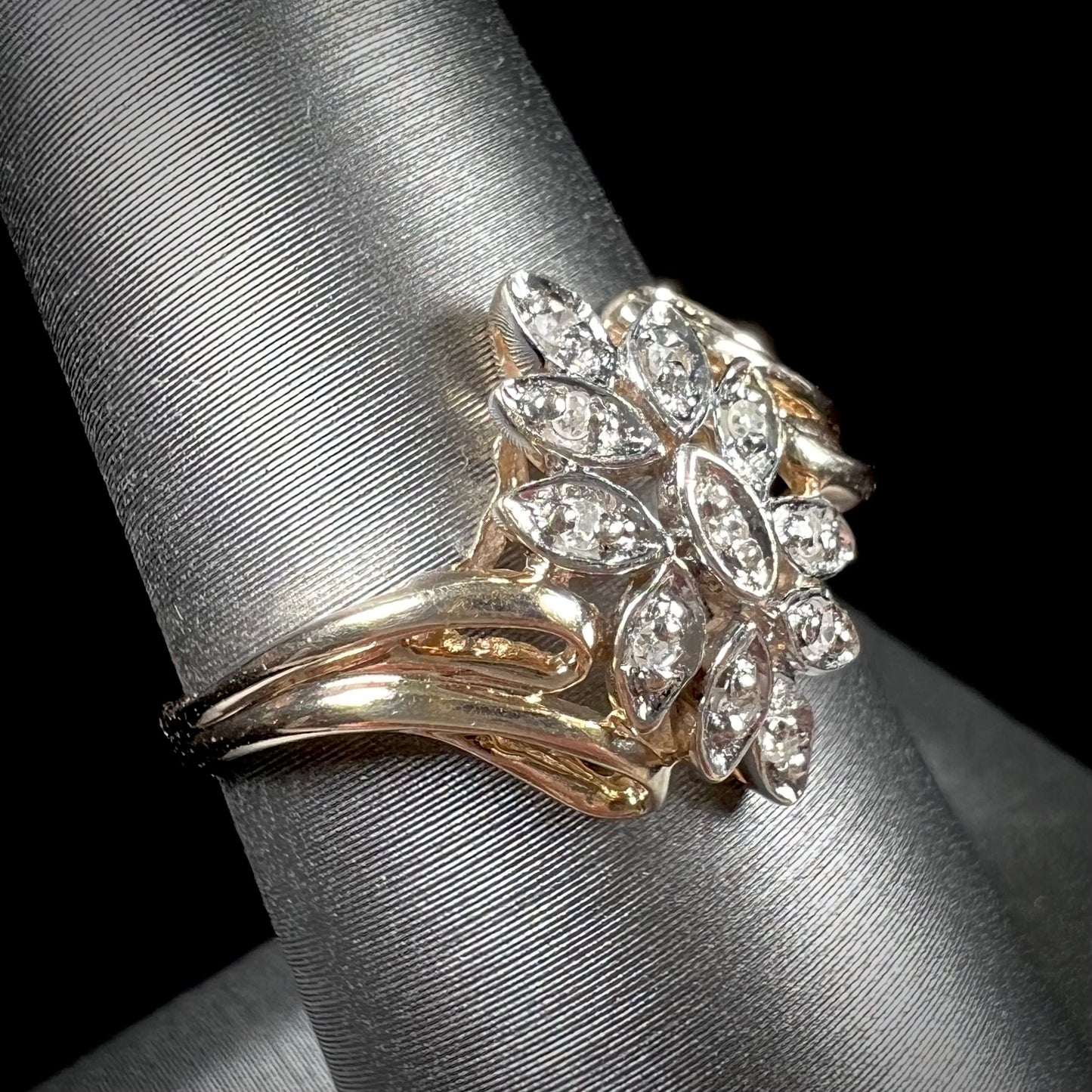 A ladies' vintage style gold diamond cluster ring.