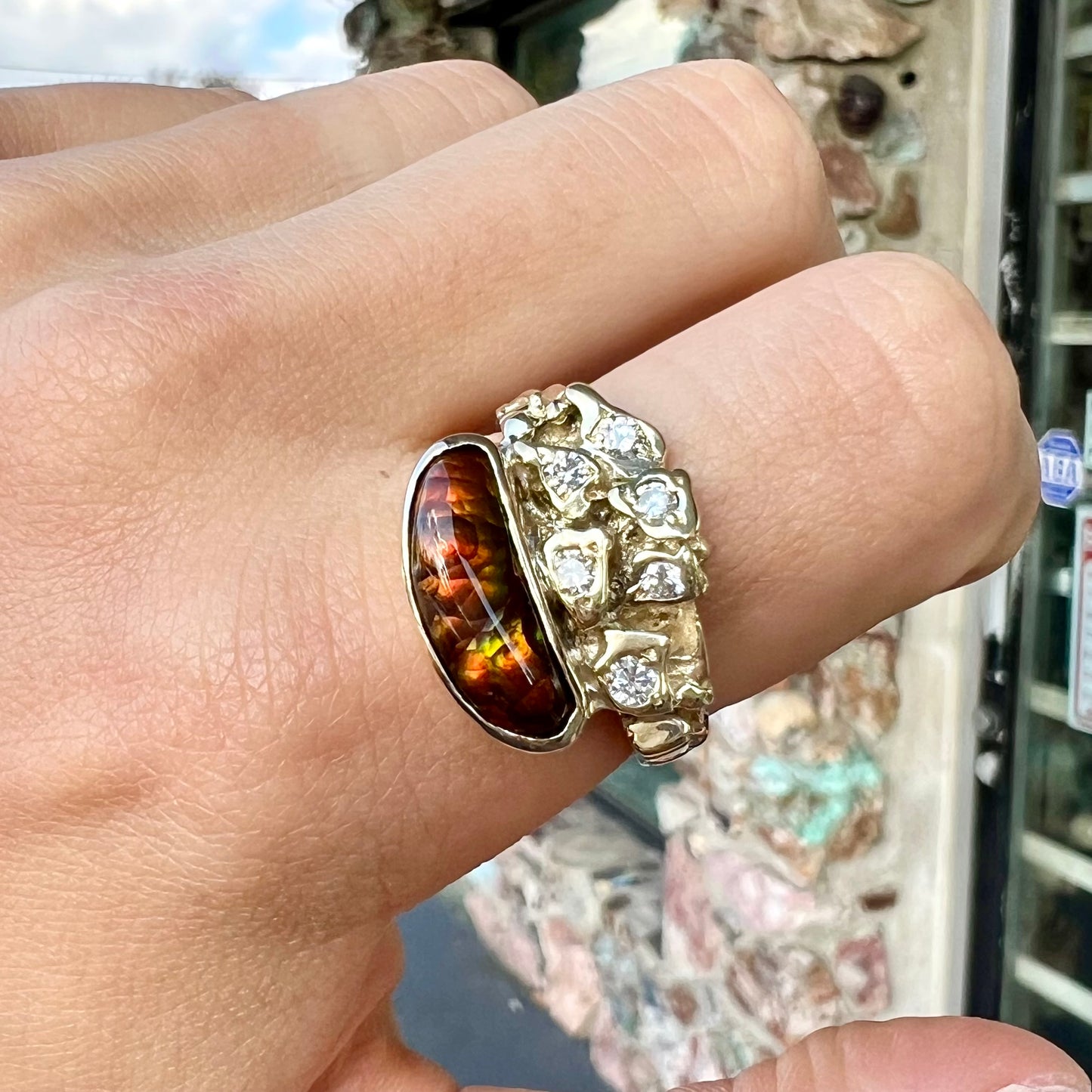 A ladies' nugget style yellow gold Mexican fire agate and diamond ring.