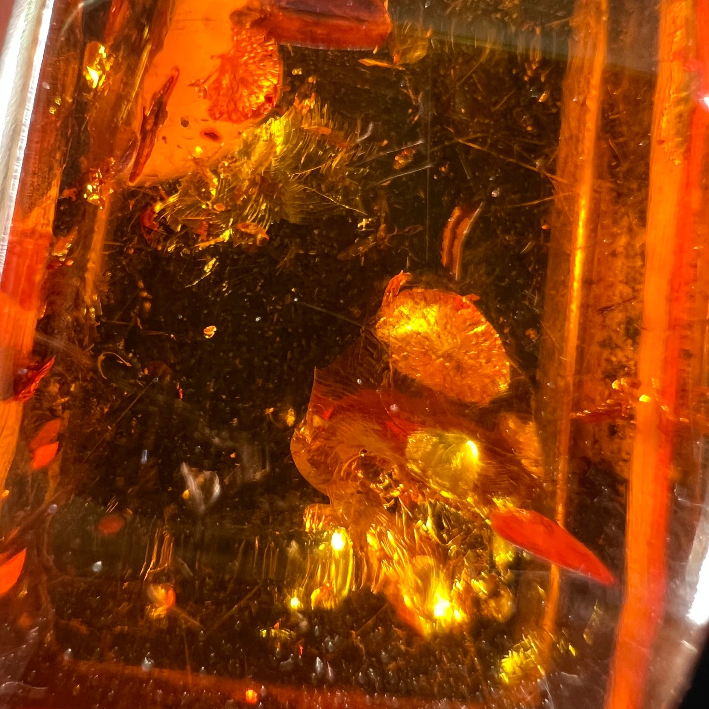 A piece of red orange sun-spangled amber.