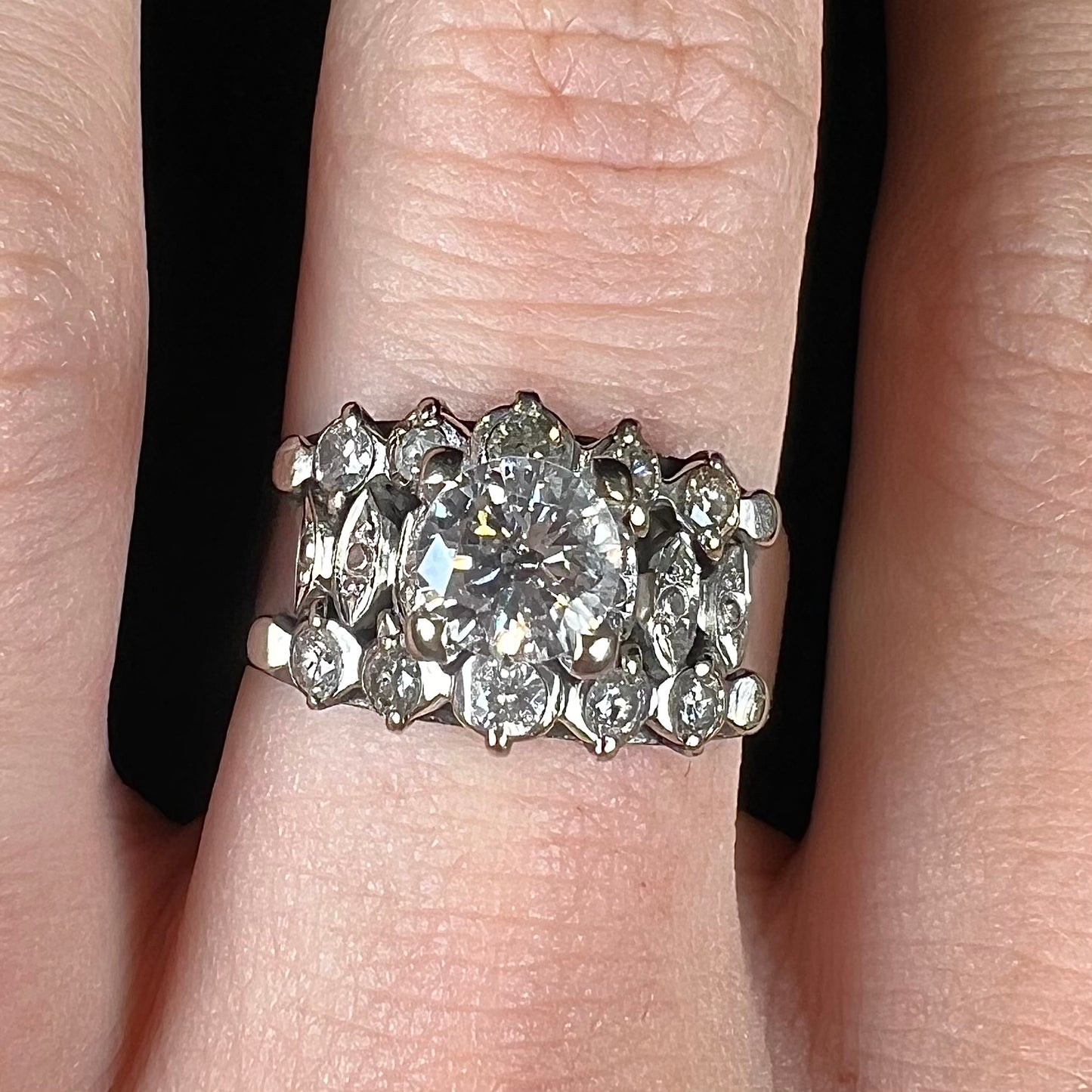 A vintage, 1940's style white gold diamond wedding ring set with a 0.68ct round diamond. The diamond has a noticeable black crystal inclusion.