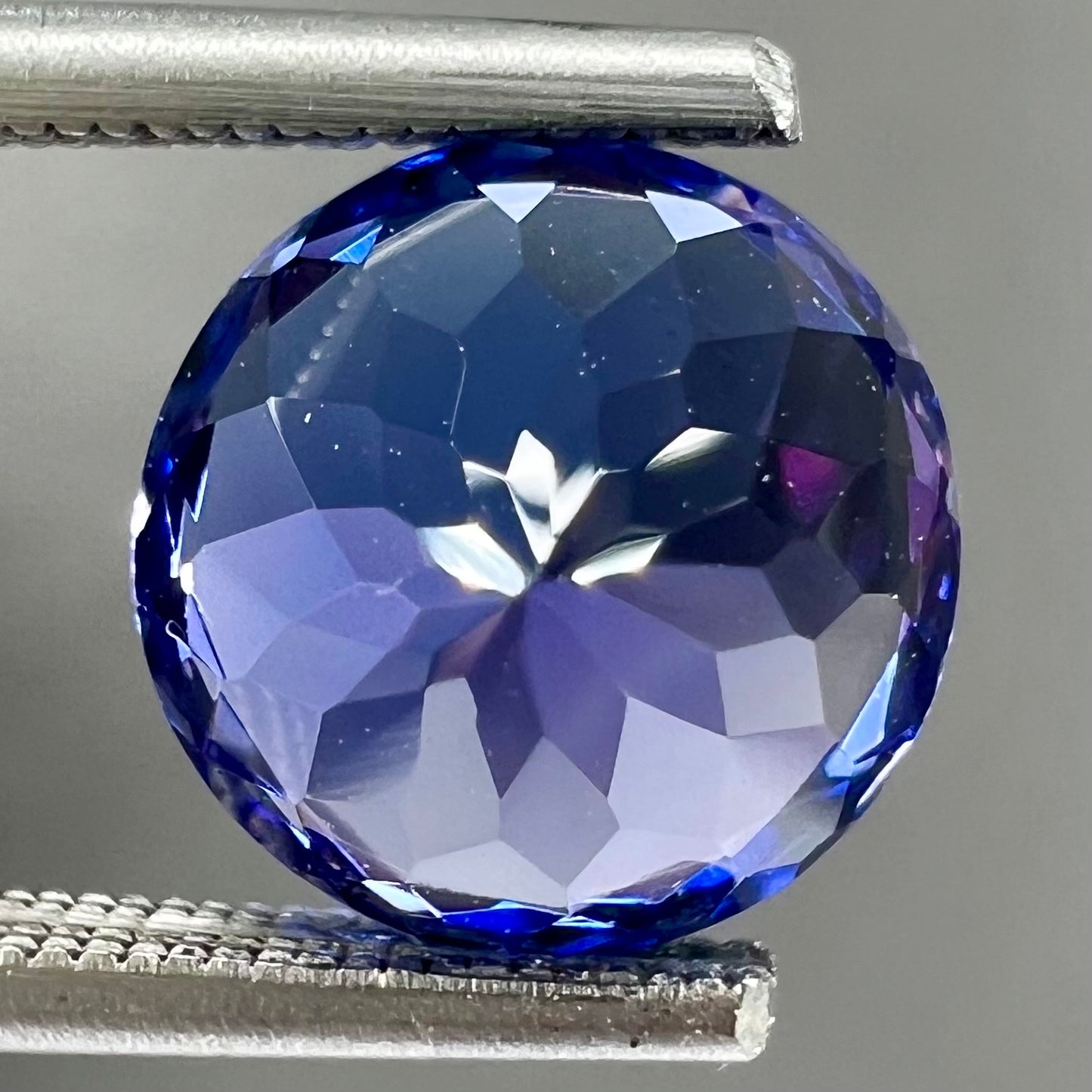 A loose, AAA grade, deep blue, round brilliant cut tanzanite stone.