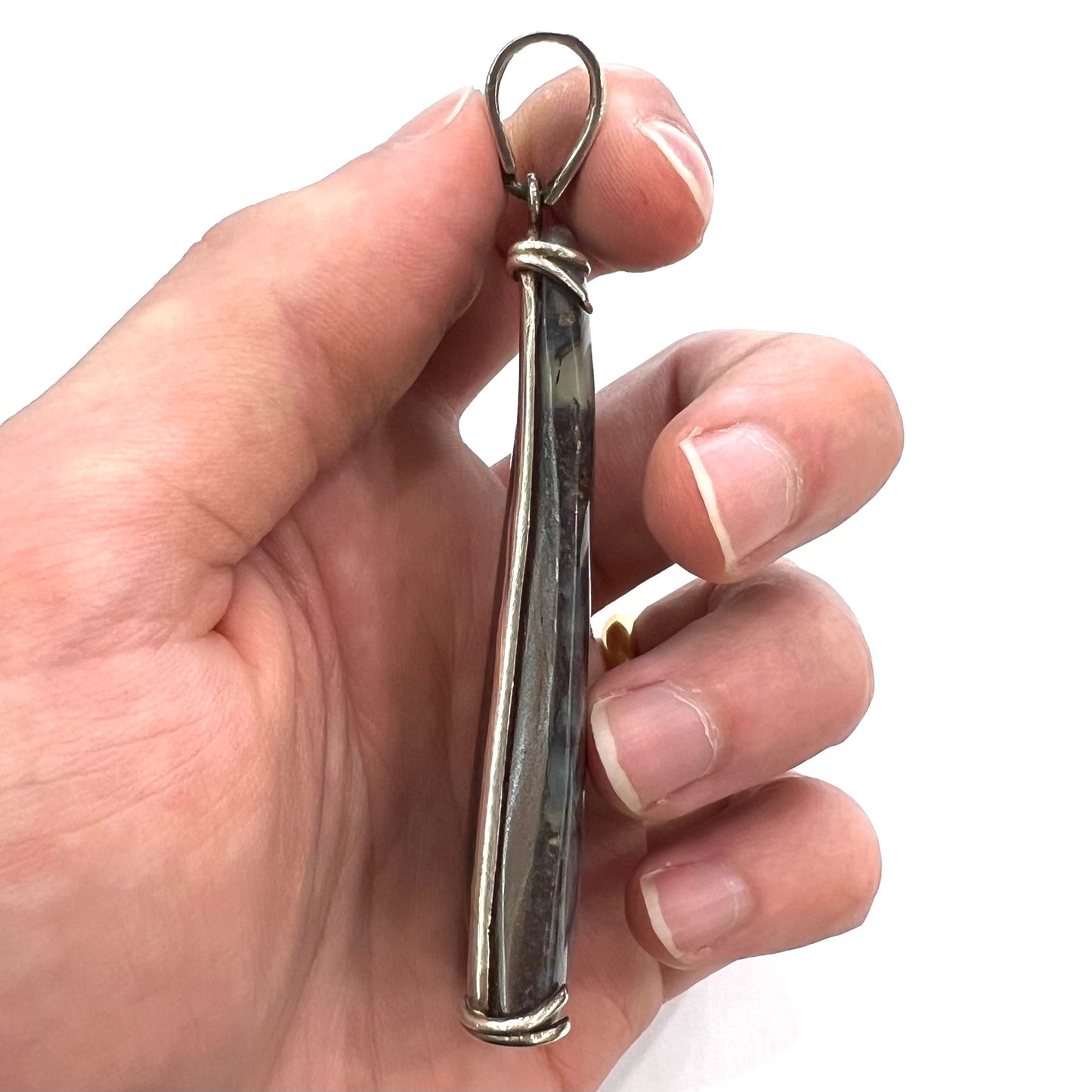 A men's sterling silver pendant set with a natural boulder opal from Quilpie, Australia.