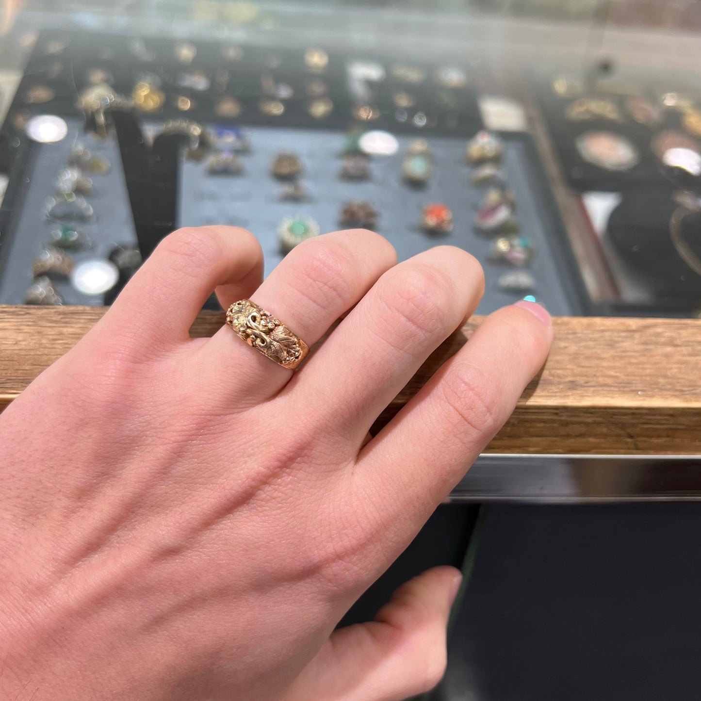 A ladies' two-tone Black Hills gold ring featuring the motif of leaves. The inside of the ring is stamped "16K" and "BARCLAY".