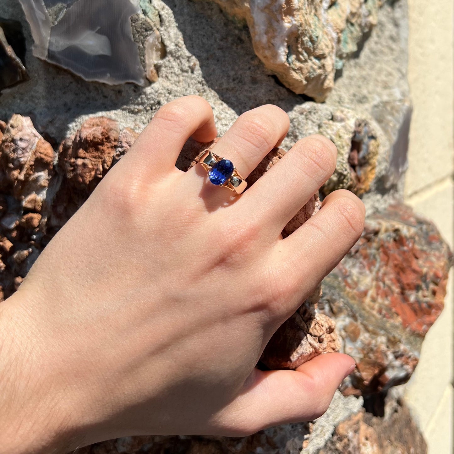 A ladies' oval cut tanzanite solitaire ring set in yellow gold.