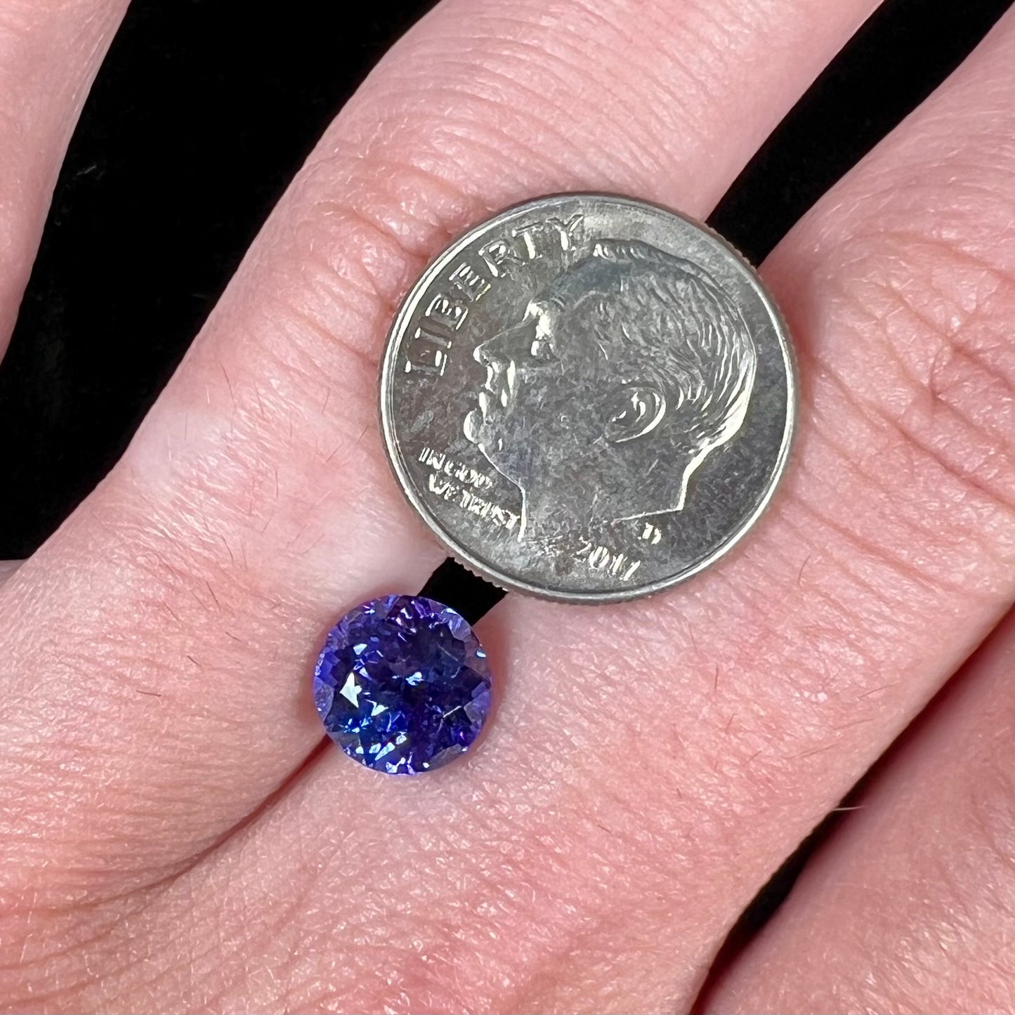 A loose, AAA grade, deep blue, round brilliant cut tanzanite stone.
