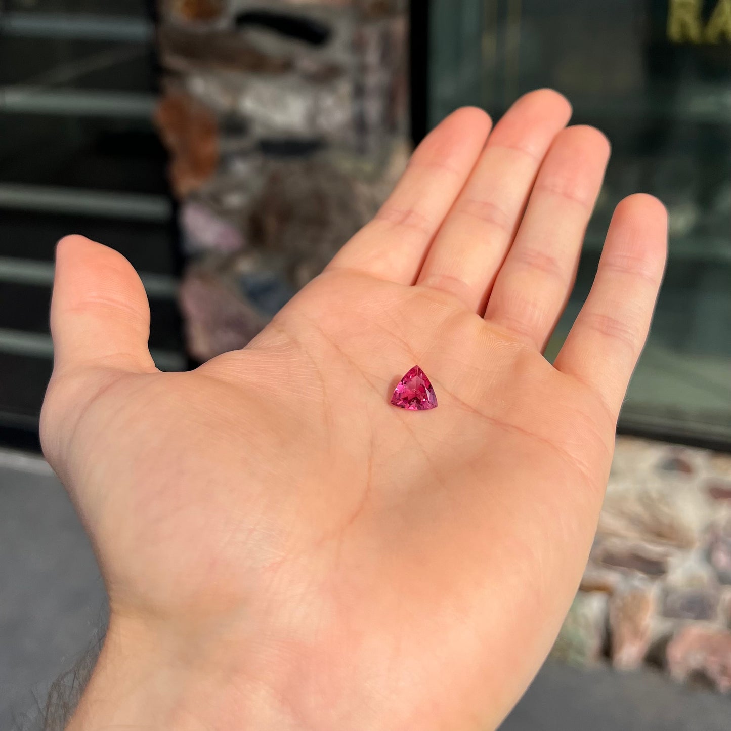 A trillion cut pink tourmaline gemstone.