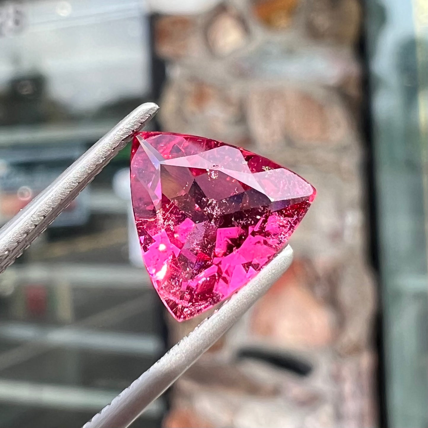 A trillion cut pink tourmaline gemstone.
