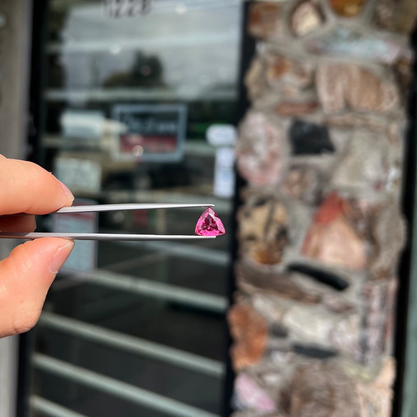 A trillion cut pink tourmaline gemstone.