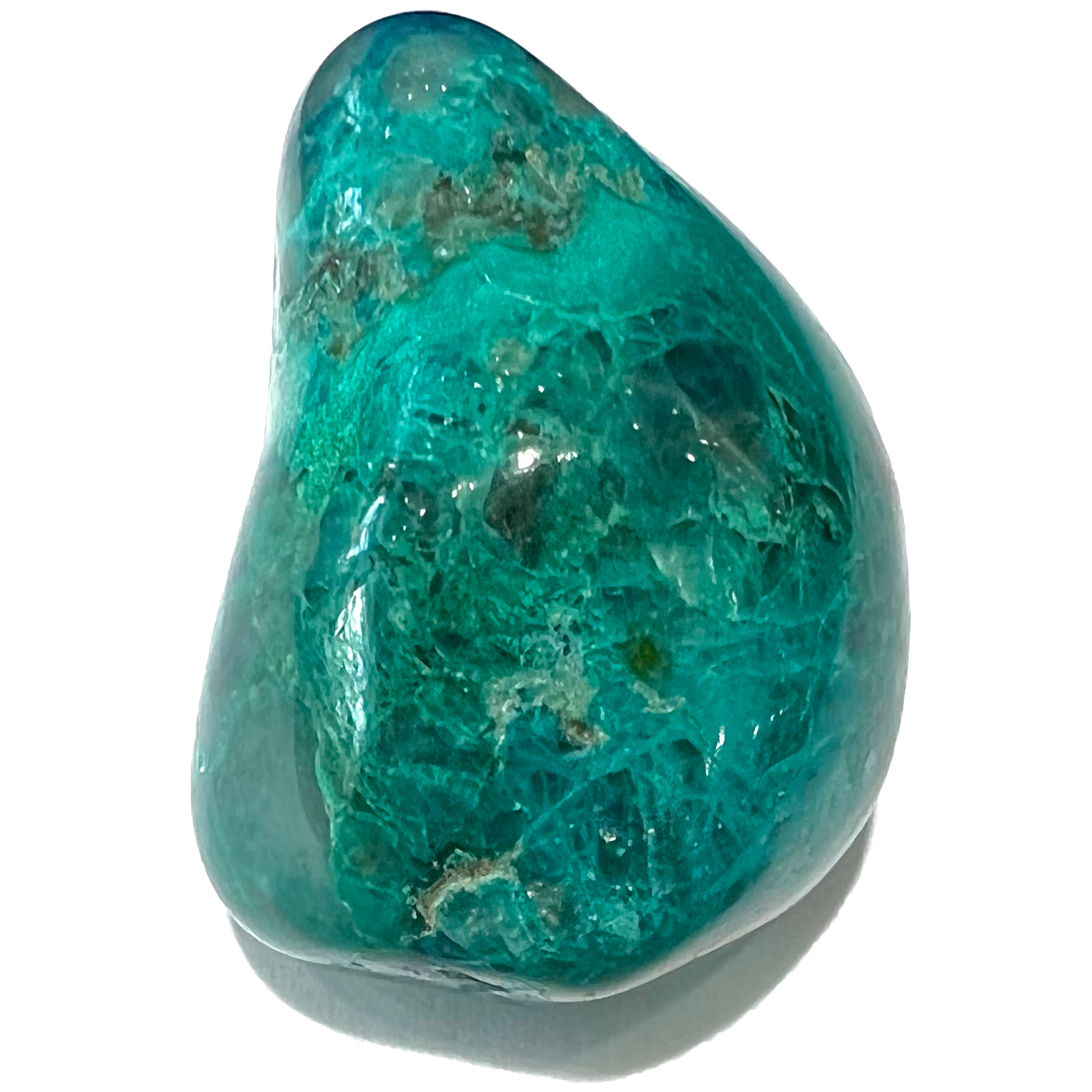 A tumbled chrysocolla stone.  The stone is a bright blue-green with blue azurite webbing.