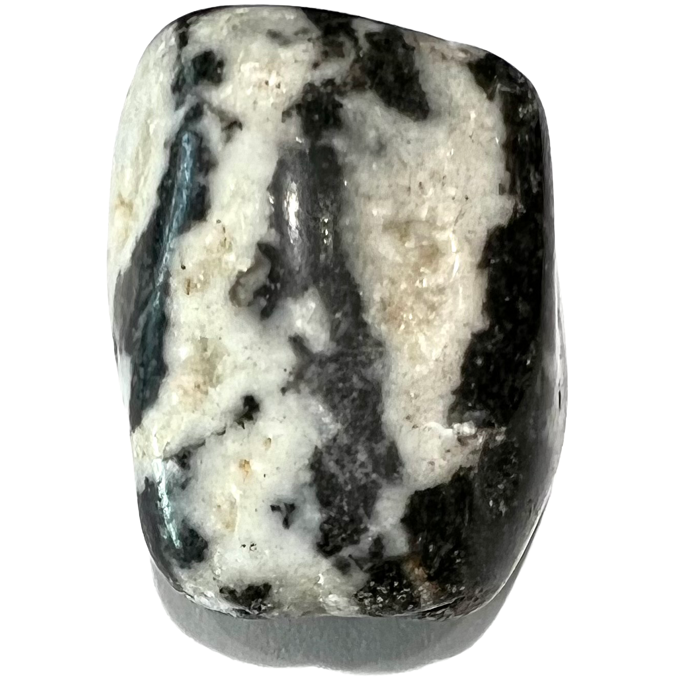 A tumble polished zebra agate stone.  The stone is black and white striped.