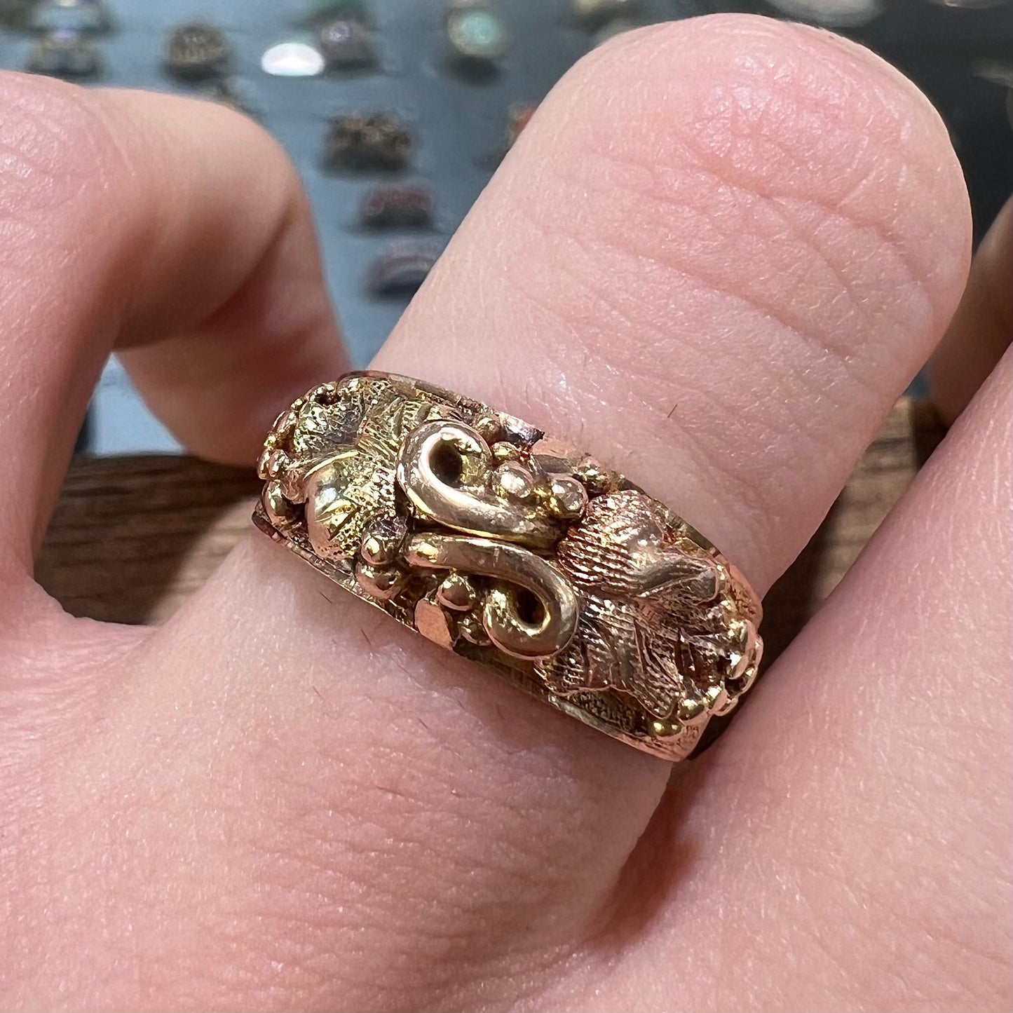 A ladies' two-tone Black Hills gold ring featuring the motif of leaves. The inside of the ring is stamped "16K" and "BARCLAY".