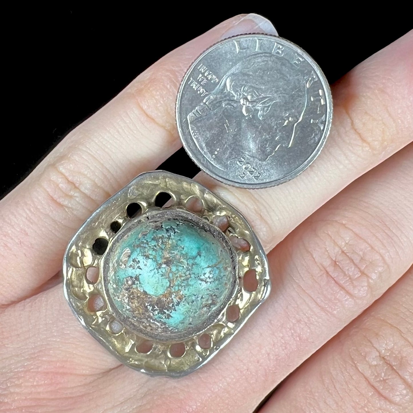 A unisex sterling silver ring with a gold wash, set with a natural, unstabilized Valley Blue turquoise stone.