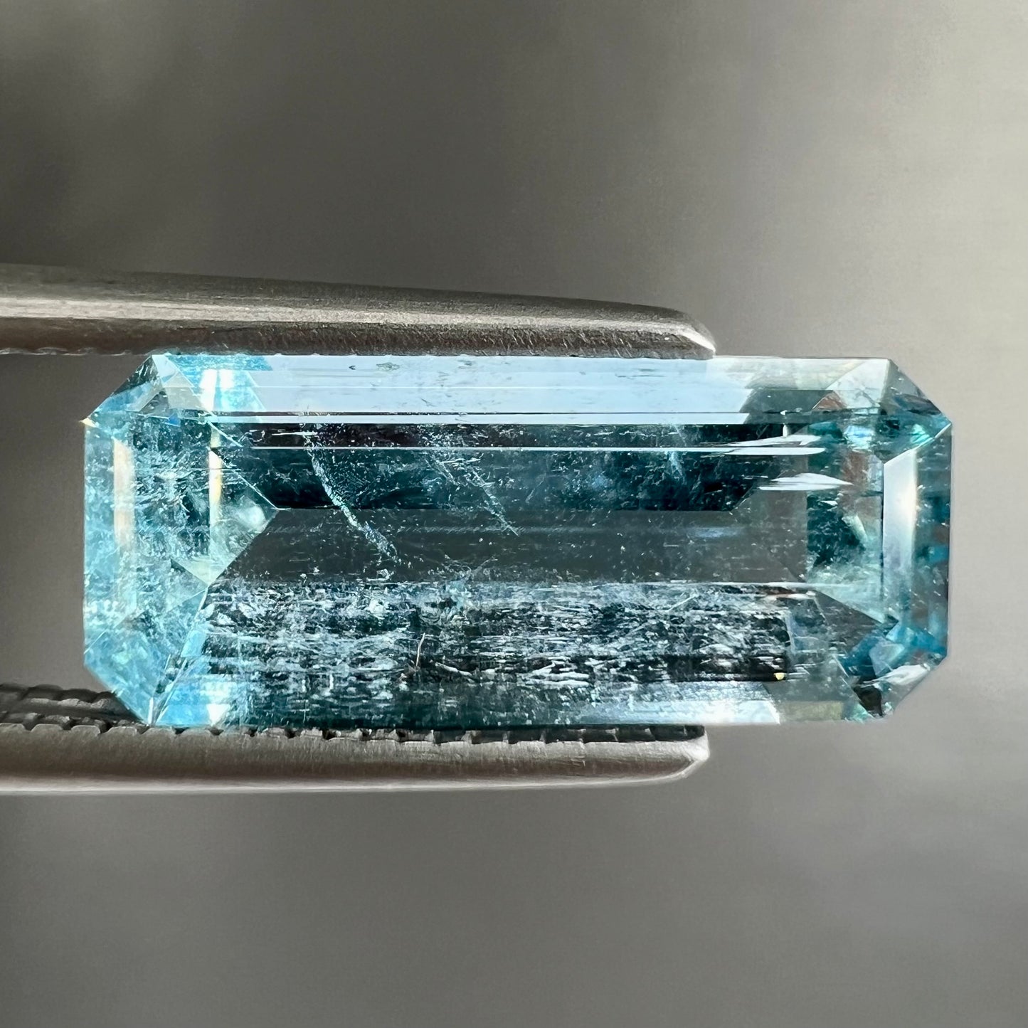A loose, emerald cut aquamarine stone from Vietnam. The stone is an ice blue color.