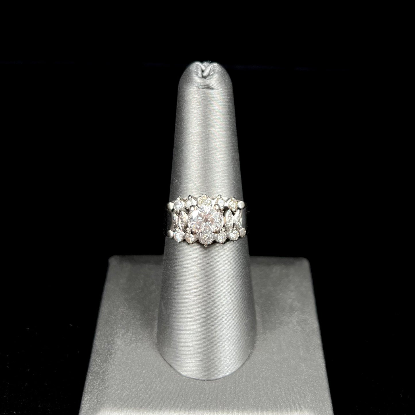 A vintage, 1940's style white gold diamond wedding ring set with a 0.68ct round diamond. The diamond has a noticeable black crystal inclusion.