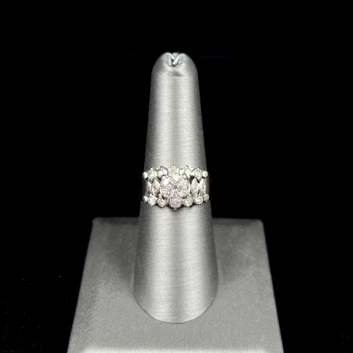 A vintage, 1940's style white gold diamond wedding ring set with a 0.68ct round diamond.  The diamond has a noticeable black crystal inclusion.