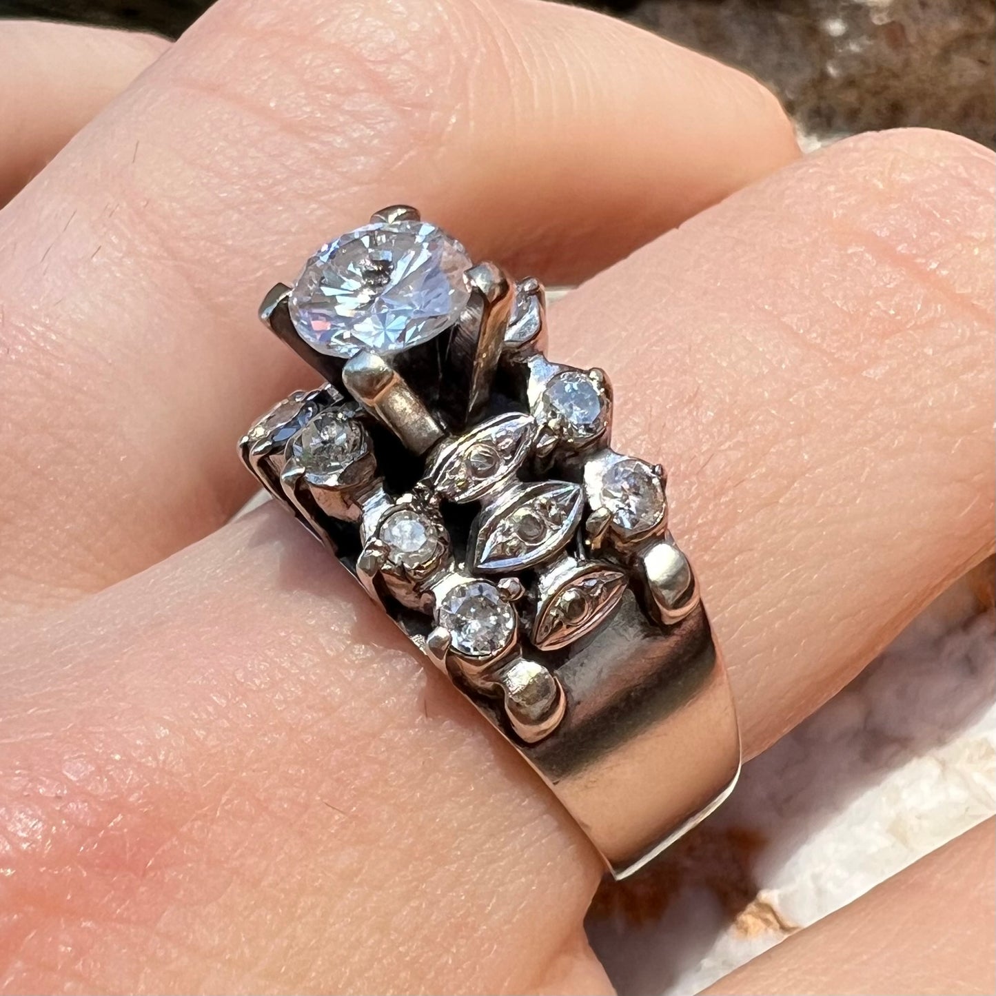 A vintage, 1940's style white gold diamond wedding ring set with a 0.68ct round diamond. The diamond has a noticeable black crystal inclusion.