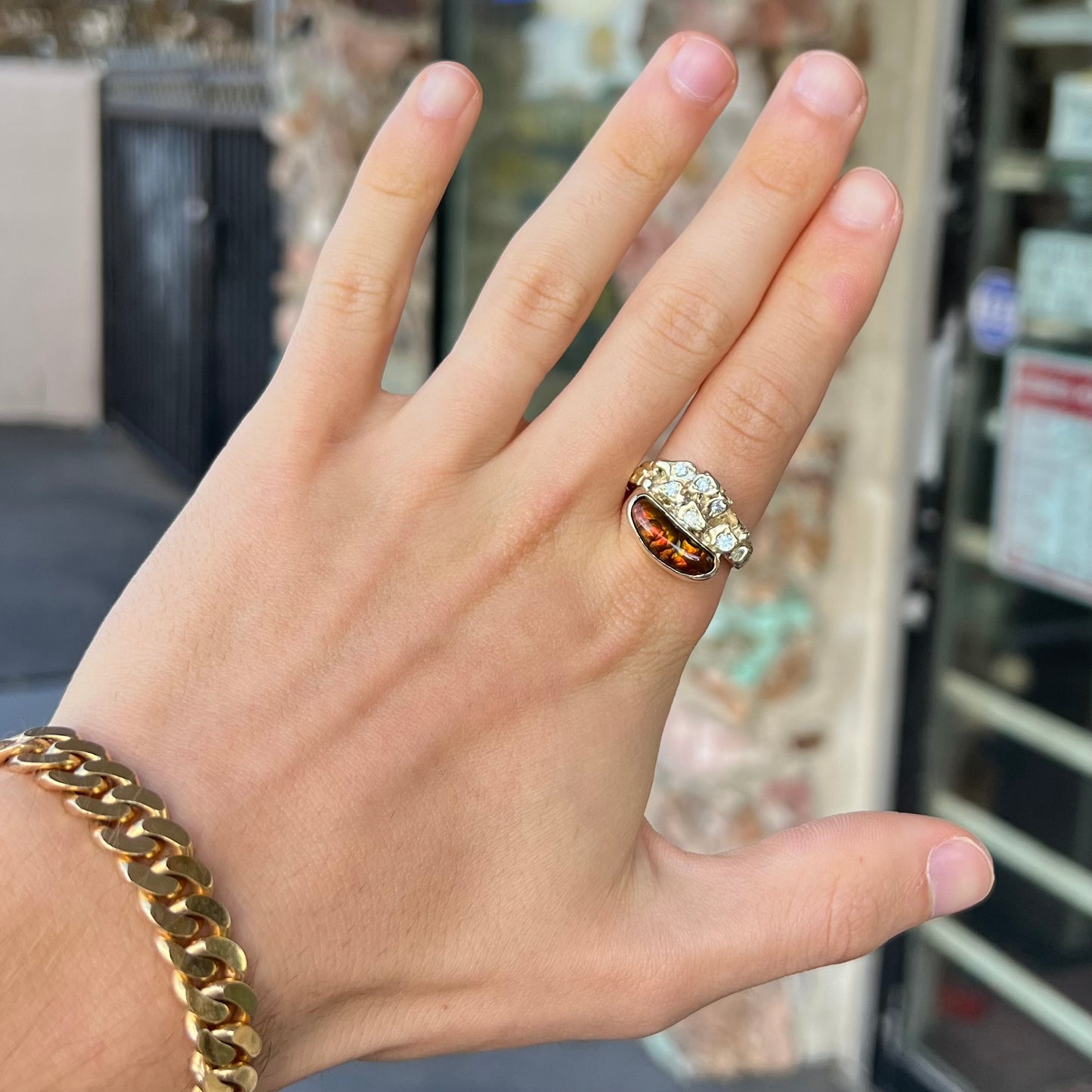 A ladies' nugget style yellow gold Mexican fire agate and diamond ring.