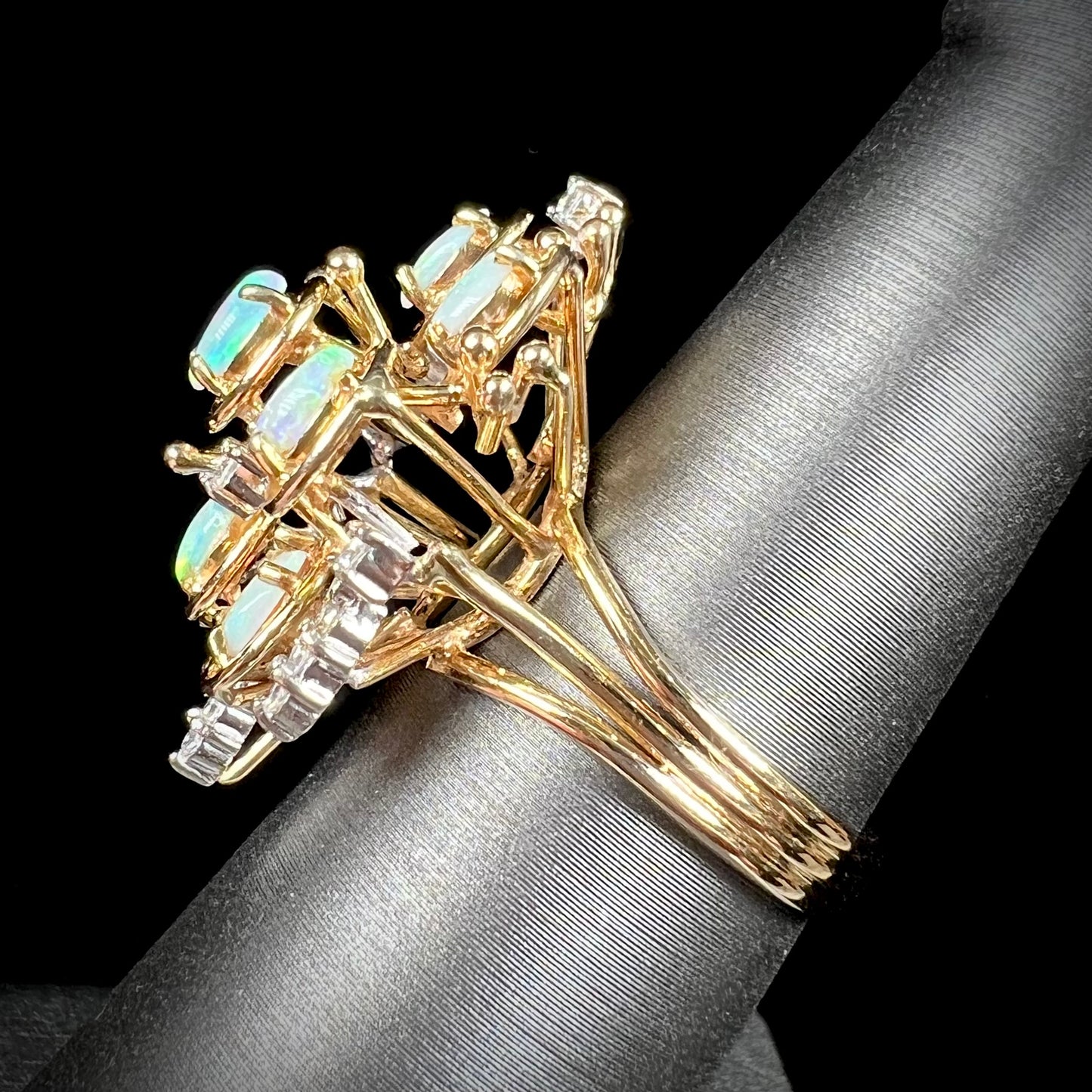 A ladies' vintage mid-century modern style opal and diamond cluster ring in yellow gold.